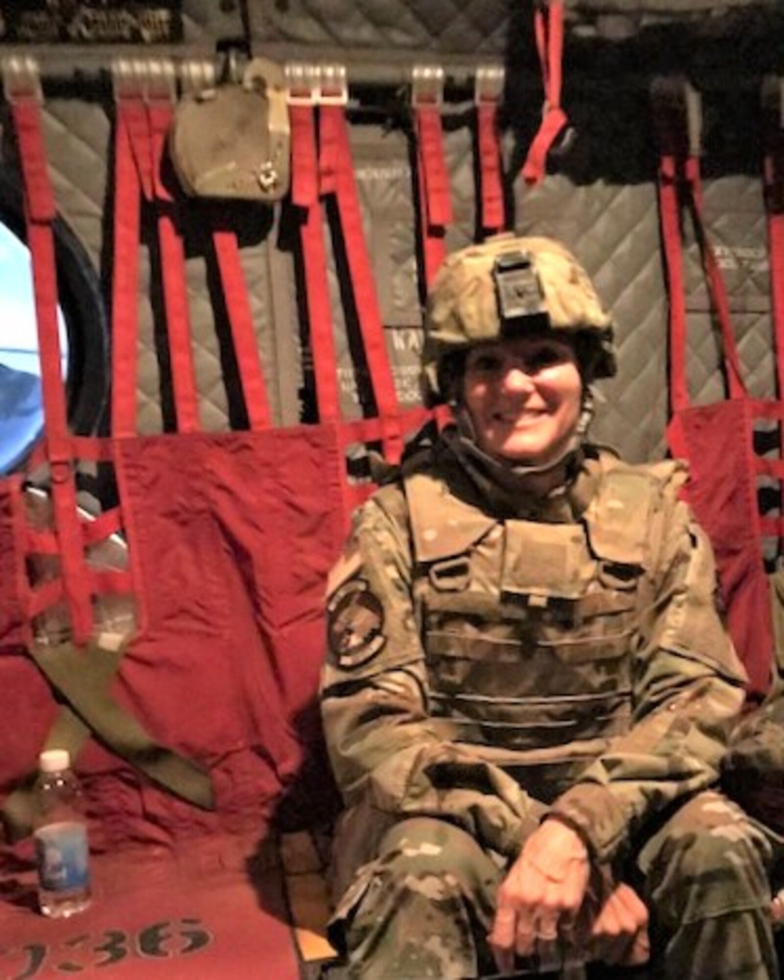 Senior Master Sgt. Joy Rohauer rides in a CH-47 Chinook Helicopter during a site visit to various bases in the Southwest Asia area of operations, August 2019. Rohauer served as the Air Force Central Command’s occupational safety superintendent, evaluating health and safety programs that increase productivity of the fighting force. (Courtesy photo)