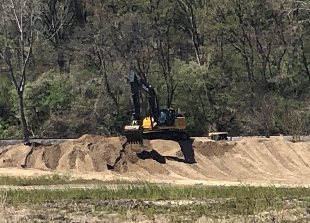 Medvolt Construction, of Kansas City, works on closing a breach in the levee in the Kansas Dept. of Corrections Levee near Leavenworth, Kan. on April 11, 2020. Work continues during the COVID-19 crisis.
