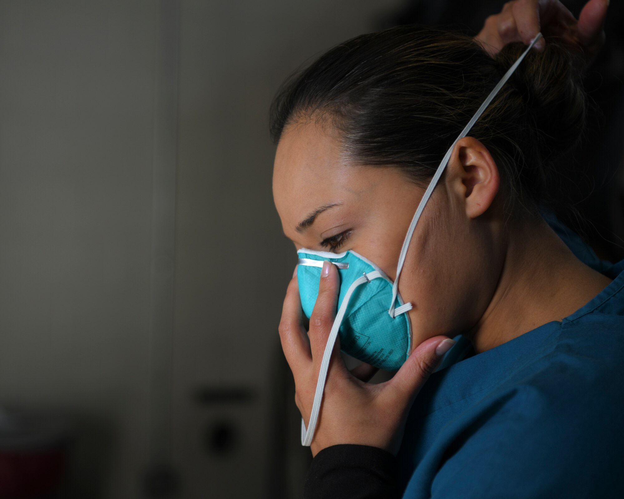 Pyeatt puts on a medical mask.