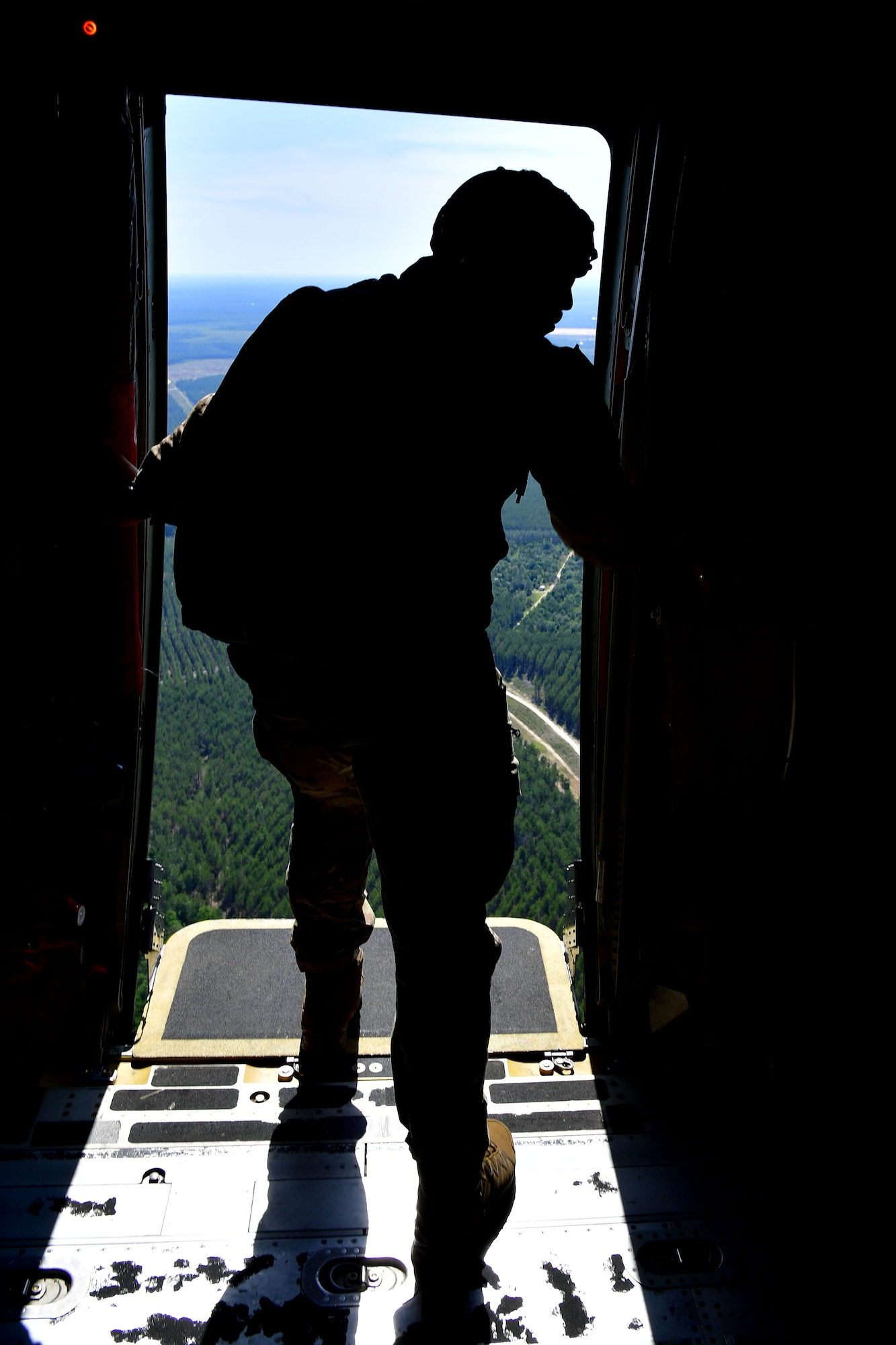 U.S. Air Force Tech. Sgt. Nader Maghribi, 19th Operations Support Squadron Survival Evasion Resistance and Escape specialist, completes the jumpmaster pre-check prior to personnel from the Air Force Special Operations Command special tactics training squadron perform static-line jumps over Sontay drop zone, Florida.