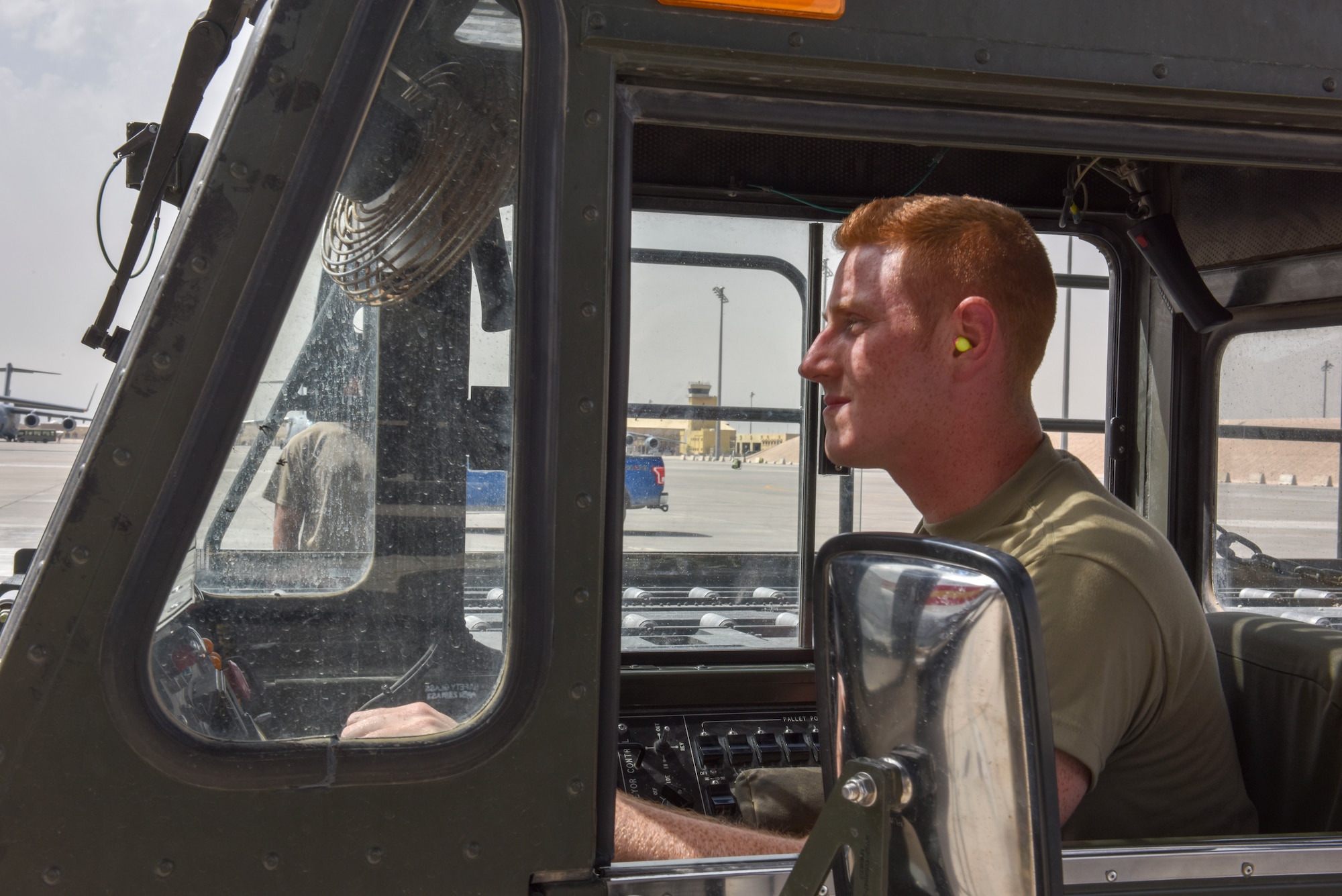 Airmen with the 8th Expeditionary Air Mobility Squadron move cargo on the flightline at Al Udeid Air Base, Qatar on April 28, 2020. The 8 EAMS Airmen support dozens of missions per day, often moving hundreds of thousands of pounds of cargo and service members around the U.S. Air Forces Central Command area of responsibility. (U.S. Air Force photo by Tech. Sgt. John Wilkes)