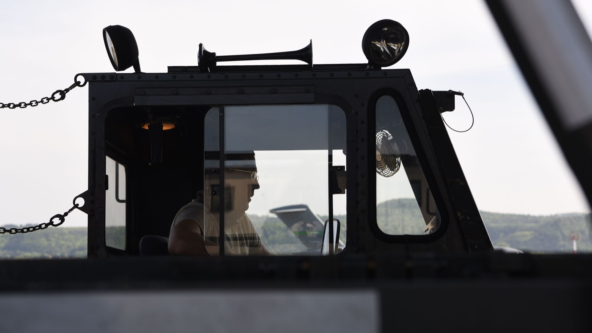 Airman First Class Kevin Silva, 721st Aerial Port Squadron ramp services air transportation agent, prepares to download cargo from an aircraft