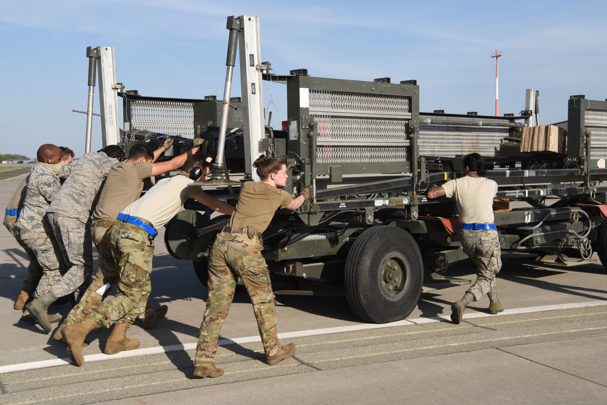 U.S. Airmen assigned to the 721st Aerial Port Squadron assist transient crew and aircraft attached to the 816th Expeditionary Airlift Squadron