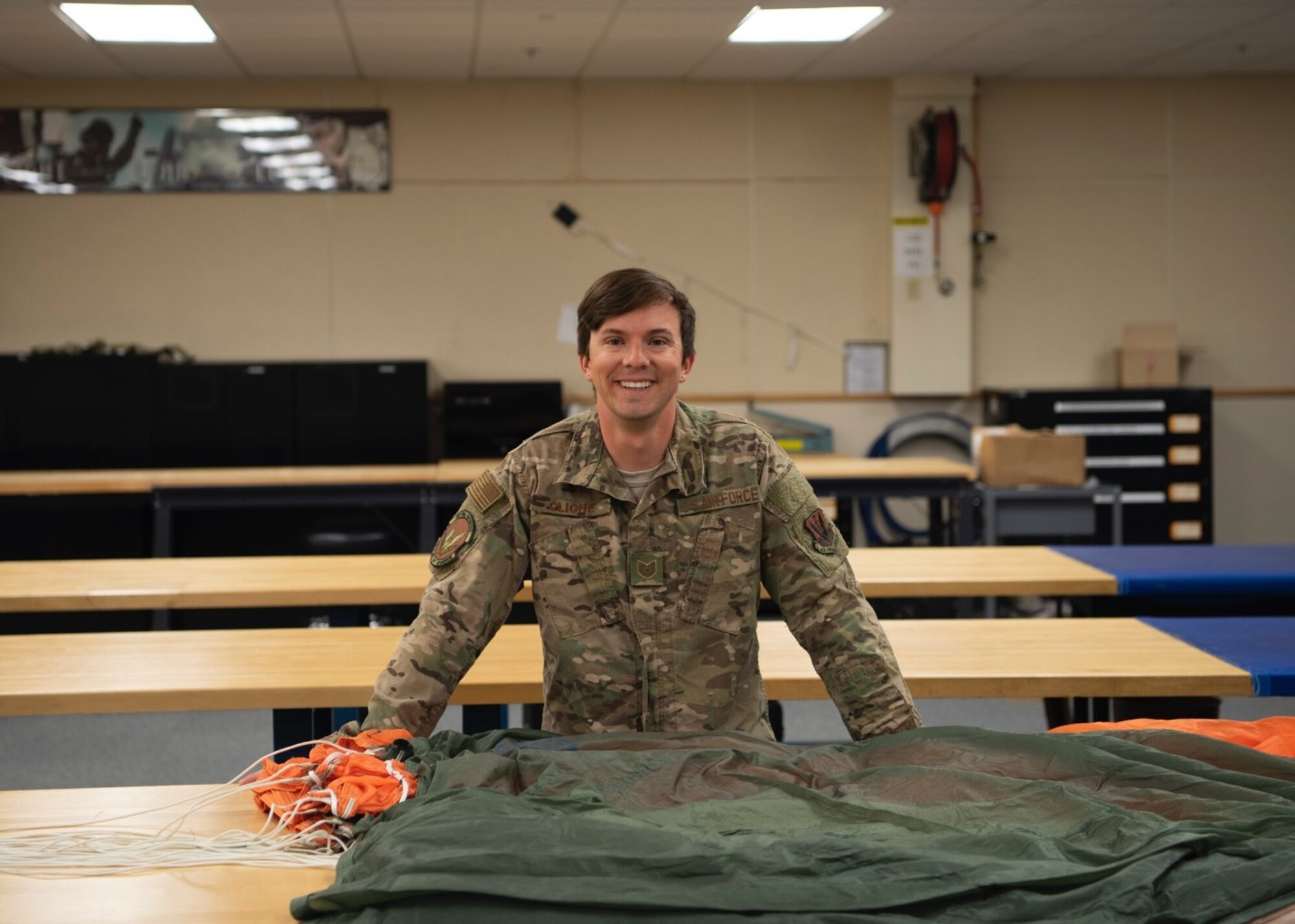 Tech. Sgt. Nicholas Cliché, 366th Operations Support Squadron aircrew flight equipment lead trainer, inspects his base-jumping gear, April 28, 2020, at Mountain Home Air Force Base, Idaho. Cliché prioritizes staying prepared and knowing his equipment as essential safety measures to base jumping. (U.S. Air Force photo by Airman 1st Class Gary Hilton)