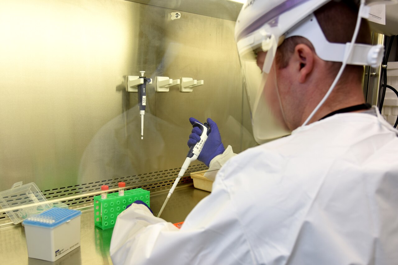 A Michigan National Guardsman performs a COVID-19 detection test.