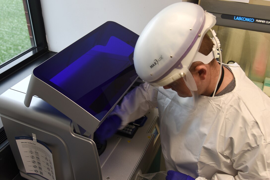 A Michigan National Guardsman performs a COVID-19 detection test.