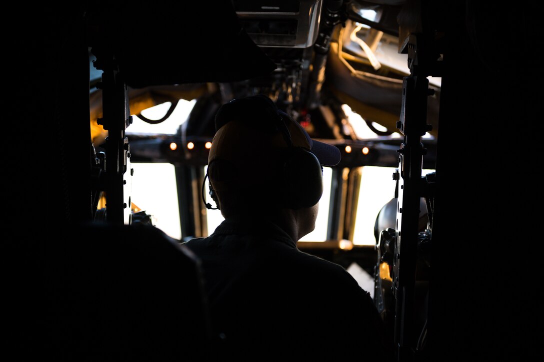 Silhouette of Airman in cockpit of B-52