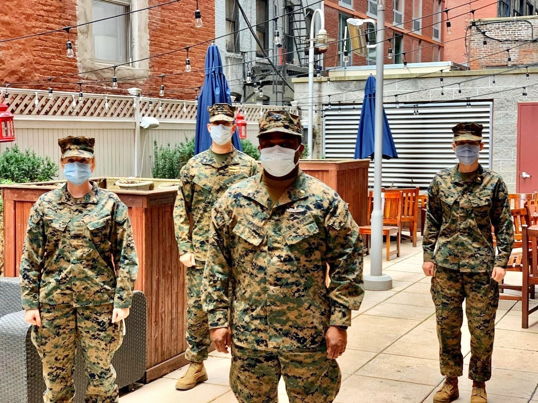 NEW YORK – U.S. Navy officers with 4th Medical Battalion, Marine Corps Forces Reserve, are interviewed at a hotel in New York, April 18, 2020. Left to right: Lt. Laura Crisp, emergency registered nurse; Cmdr. Thomas Shu, critical care registered nurse; Lt. Ikeakaghichi Akanu, emergency registered nurse; Lt. Cmdr. Jody McIntosh, critical care registered nurse. In support of the Department of Defense COVID-19 response, U.S. Northern Command, through U.S. Army North, is providing military support to the Federal Emergency Management Agency to help communities in need. (Courtesy photo)