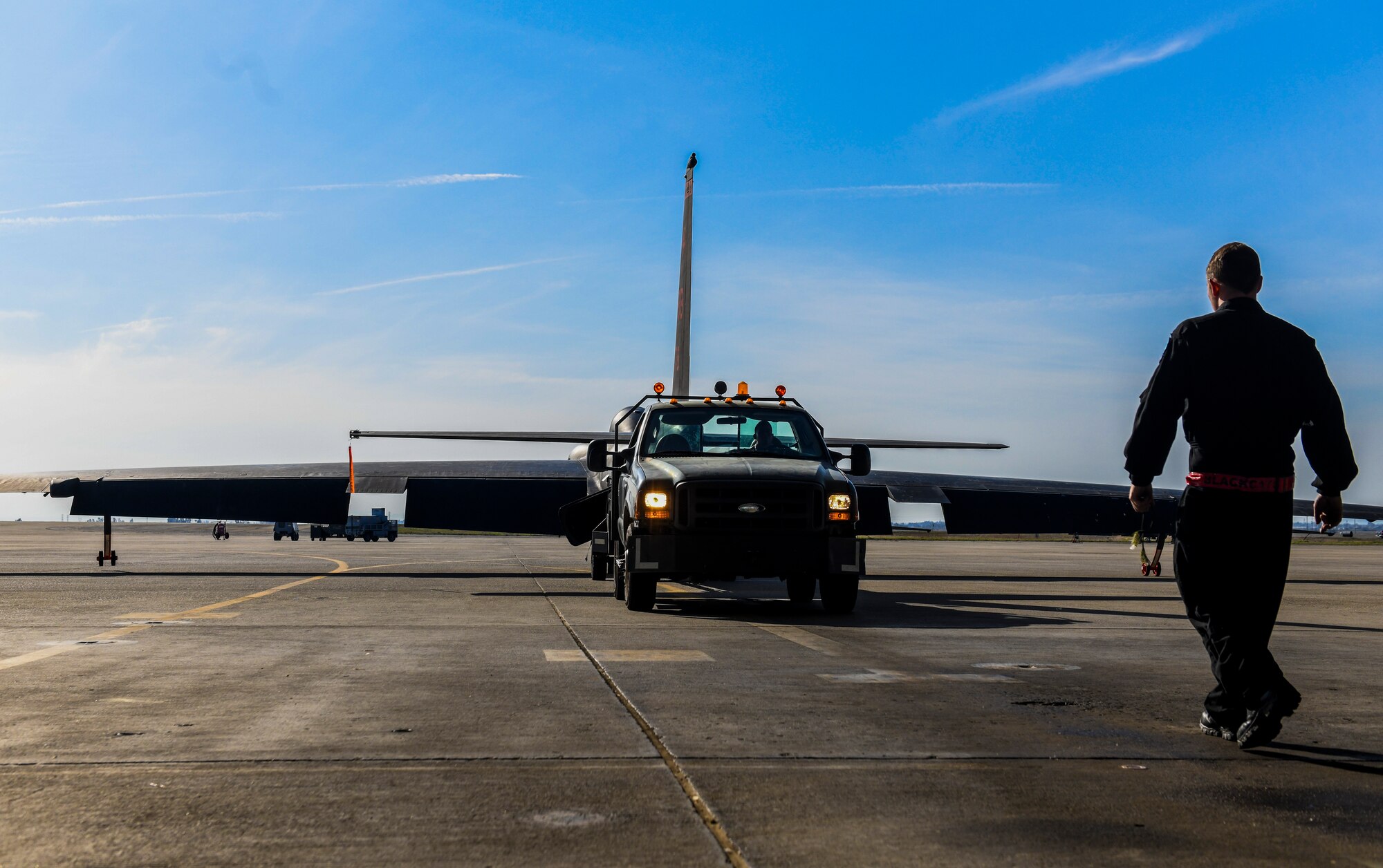 9th Aircraft Maintenance Squadron (AMXS) dedicated crew chief and members tow a U-2 Dragon Lady into a hangar