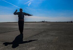 9th Aircraft Maintenance Squadron (AMXS) dedicated crew chief and members tow a U-2 Dragon Lady into a hangar