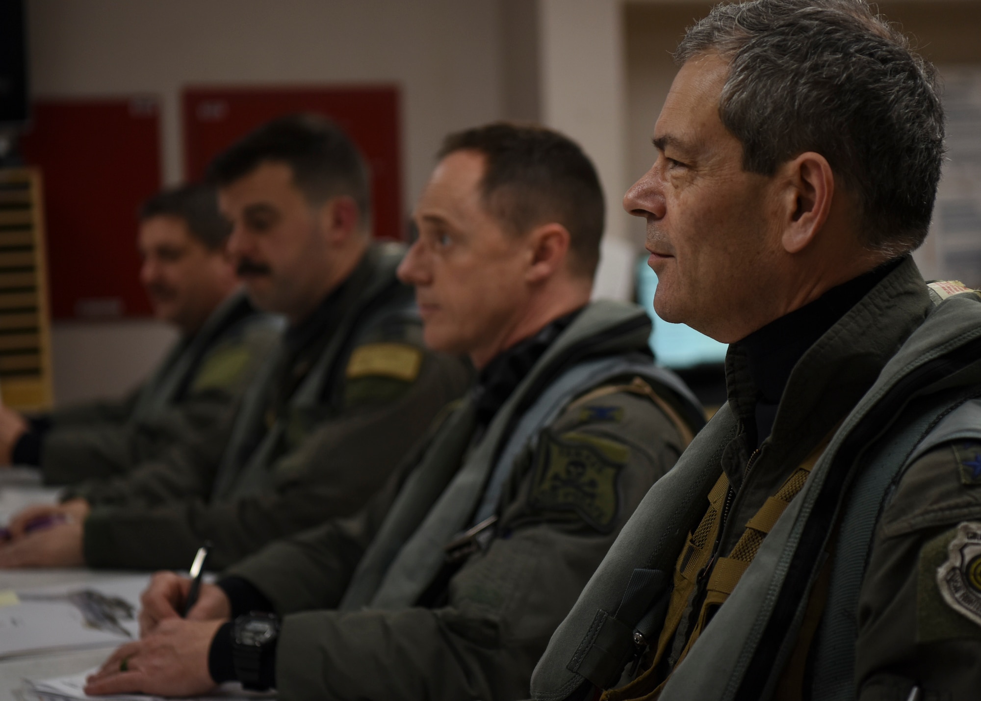 U.S. Air Force Lt. Gen. Ken Wilsbach, 7th Air Force commander, and Col. Tad Clark, 8th Fighter Wing commander, receive a preflight brief before a routine training flight at Kunsan Air Base, Republic of Korea, April 30, 2020. During his visit, Wilsbach received a comprehensive look into the Wolf Pack mission and the important roles of several units.  (U.S. Air Force photo by Staff Sgt. Anthony Hetlage)