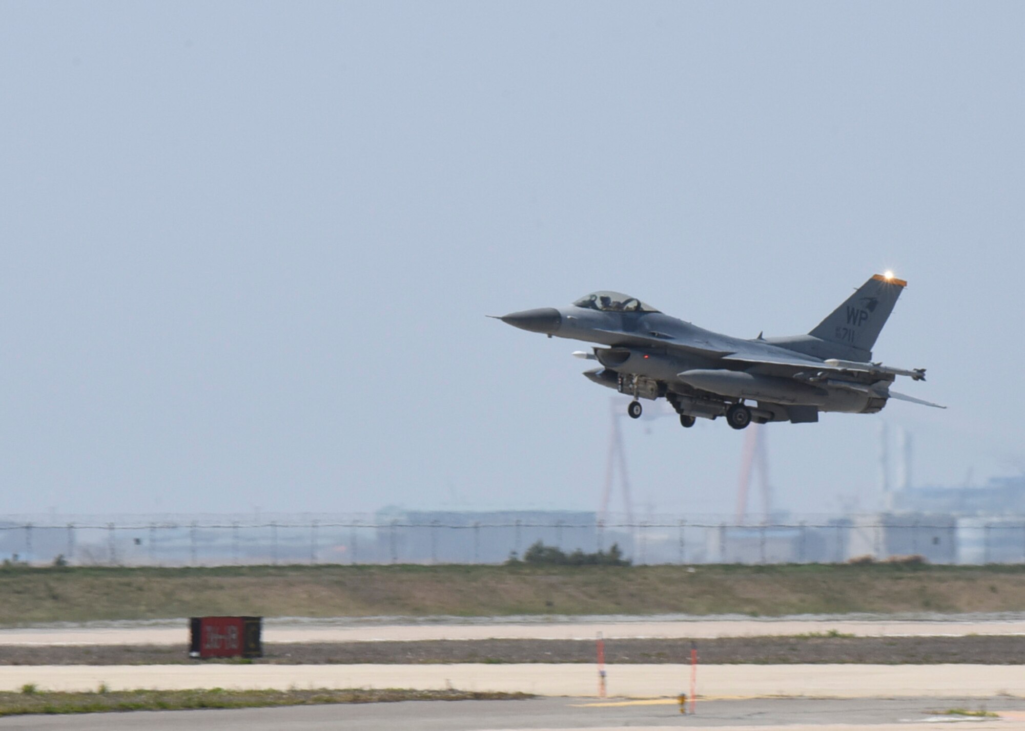 U.S. Air Force Lt. Gen. Ken Wilsbach, 7th Air Force commander, takes off in an F-16 Fighting Falcon aircraft during a routine training flight at Kunsan Air Base, Republic of Korea, April 30, 2020. Wilsbach joined Col. Tad Clark, 8th Fighter Wing commander, for a routine training flight in an F-16. (U.S. Air Force photo by Staff Sgt. Anthony Hetlage)