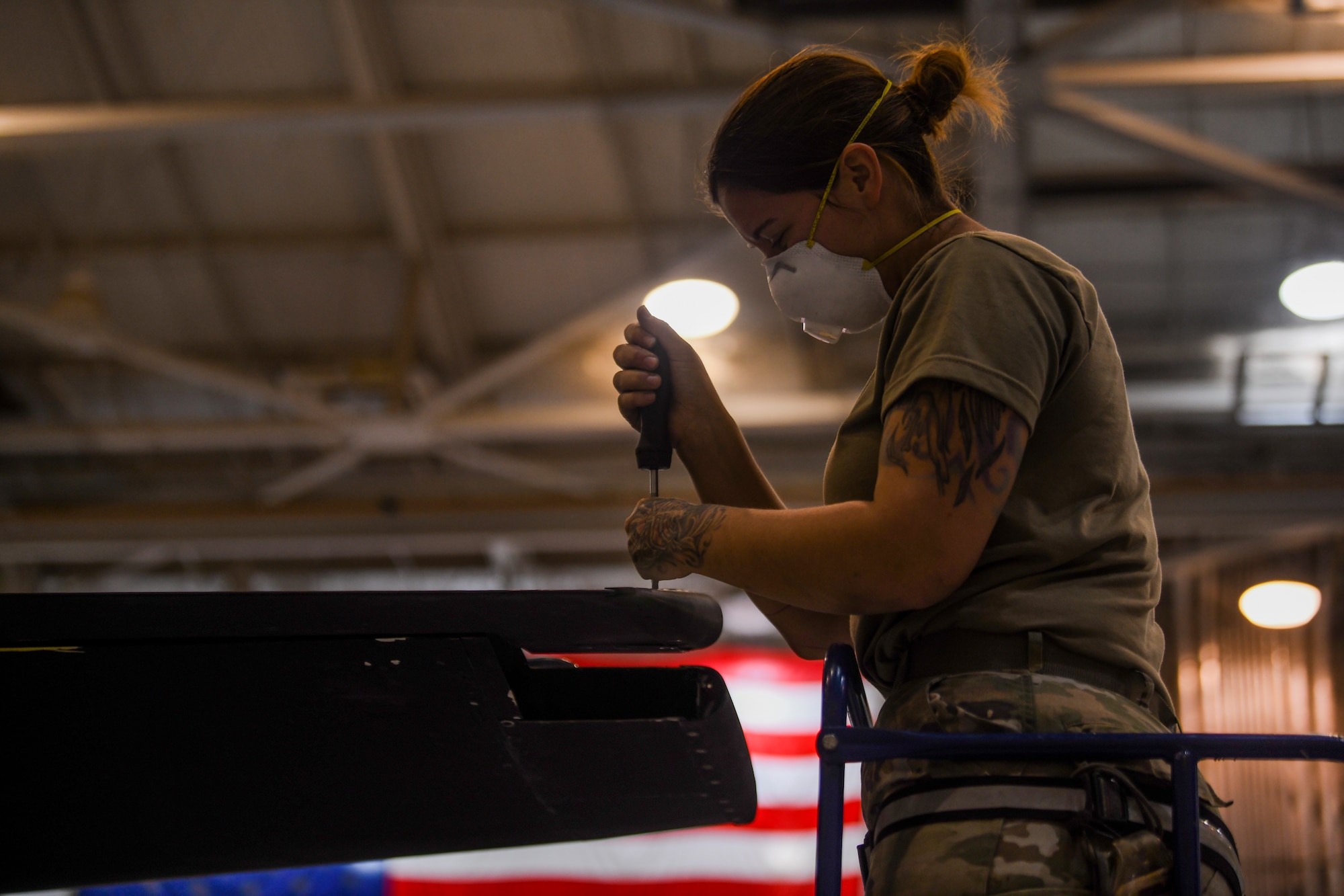 9th Maintenance Squadron repair and reclamation craftsman, work mon the tail of a U-2 Dragon Lady