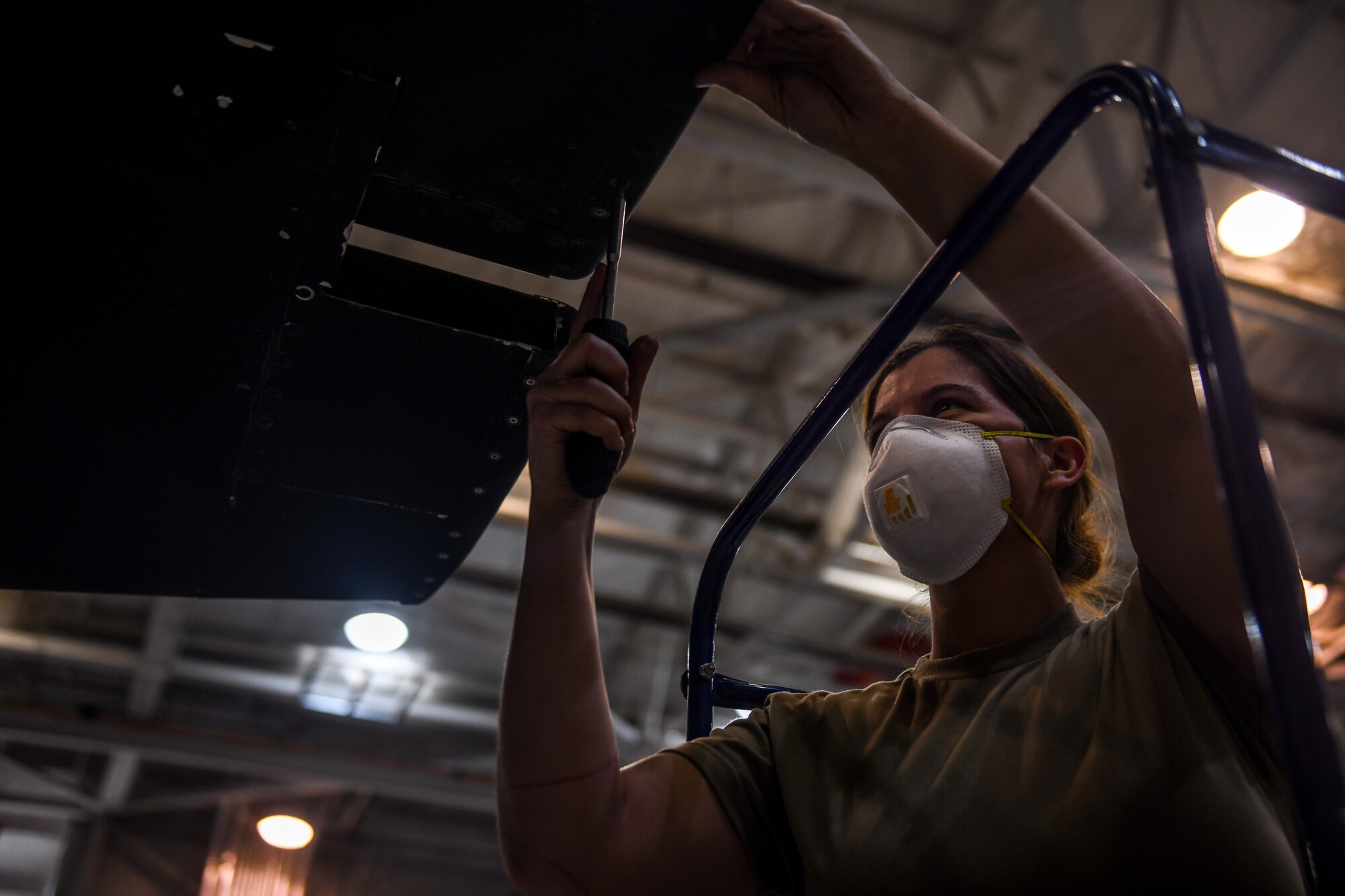 9th Maintenance Squadron repair and reclamation craftsman, work mon the tail of a U-2 Dragon Lady