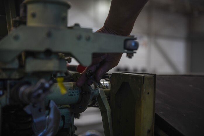 9th Maintenance Squadron repair and reclamation craftsman, work mon the tail of a U-2 Dragon Lady