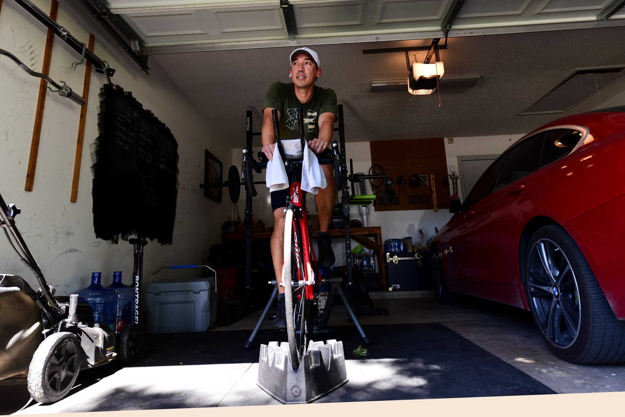Capt. Joshua White, 434th Flying Training Squadron X flight commander and instructor pilot, cycles in place for his morning workout, April 23, 2020 in Del Rio, Texas. To him, biking isn’t about the exercise as much as it’s about the ability to be present--not wrapped up in the past or future. For many whose schedules are altered due to quarantine, there is more time to pursue fitness. (U.S. Air Force photo by Senior Airman Anne McCready)