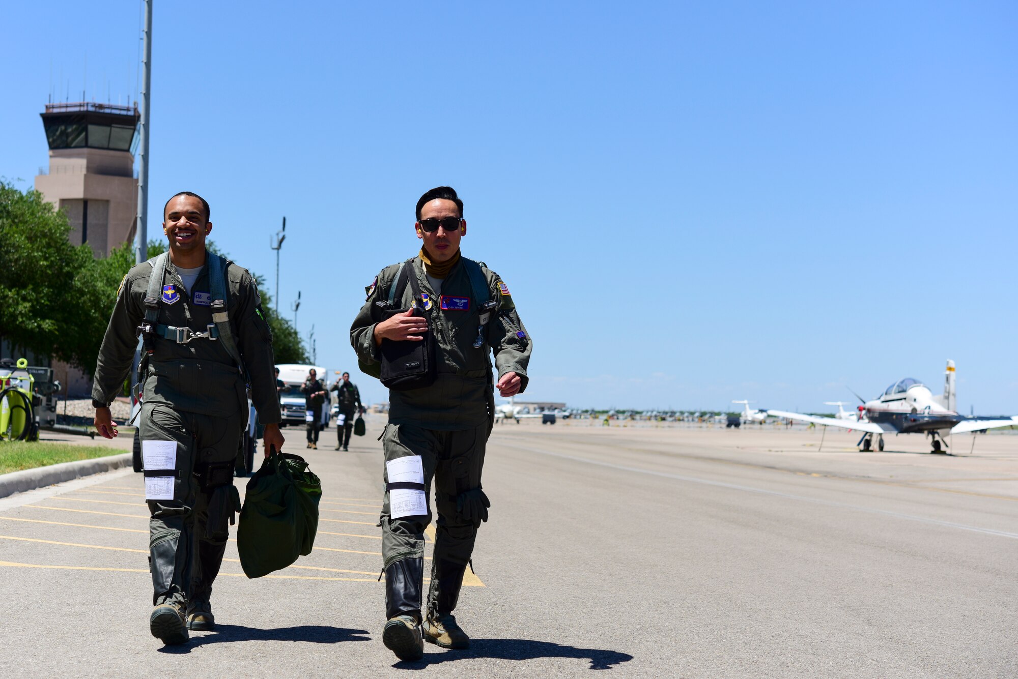 2nd Lt. Roderick Byars, 47 Student Squadron student pilot, and Capt. Joshua White, 434th Flying Training Squadron X flight commander and instructor pilot, walk out on the flightline, April 23, 2020 at Laughlin Air Force Base, Texas, to a T-6A Texan II, the aircraft the 434th FTS trains with. The specialized undergraduate pilot training students still complete the same number of tests, simulations and flights despite COVID-19. (U.S. Air Force photo by Senior Airman Anne McCready)