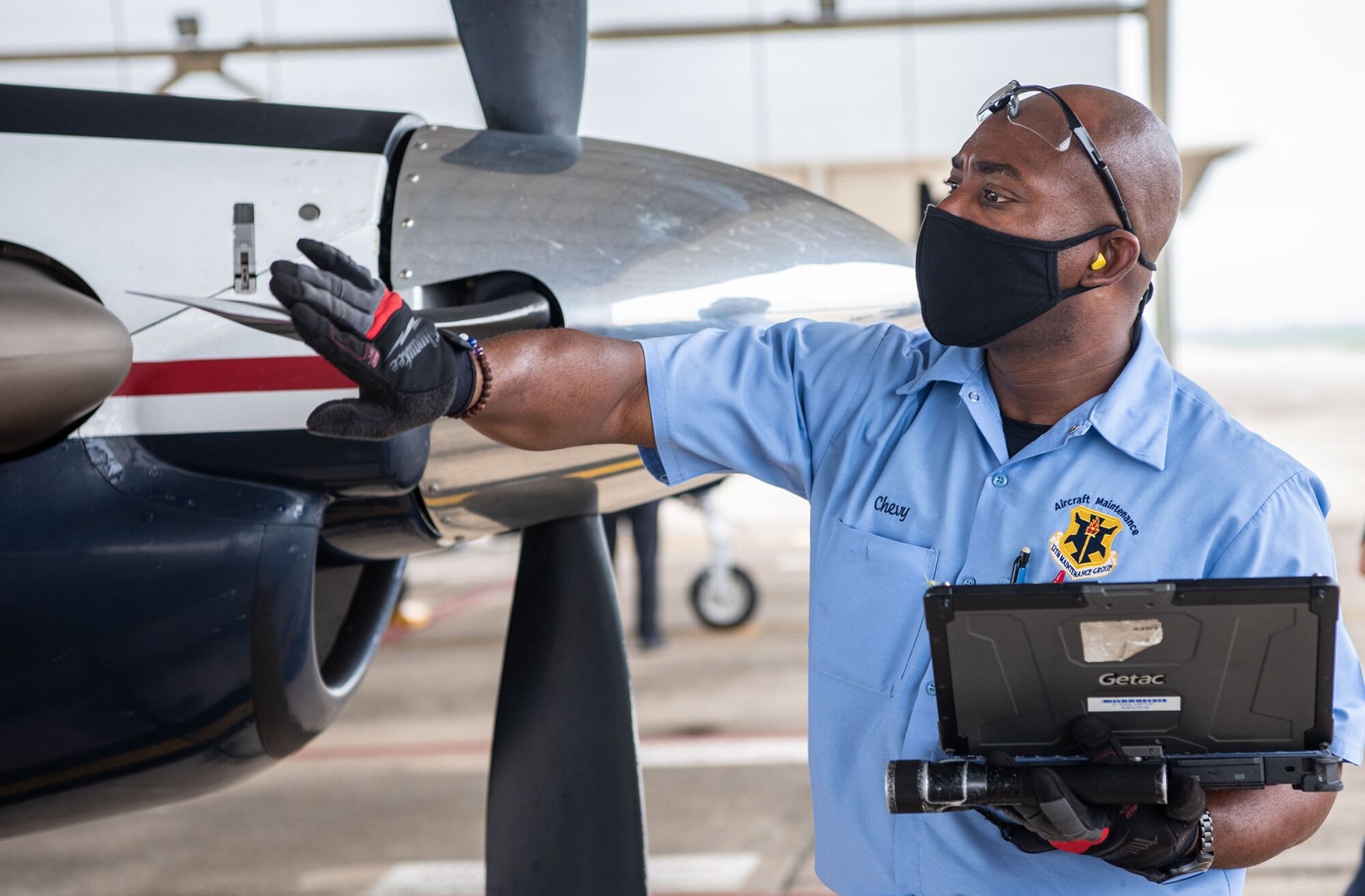 Shevon Vacianna, 12th Aircraft Maintenance Squadron, inspects the propeller of a T-6 Texan aircraft at Joint Base San Antonio-Randolph April 7.