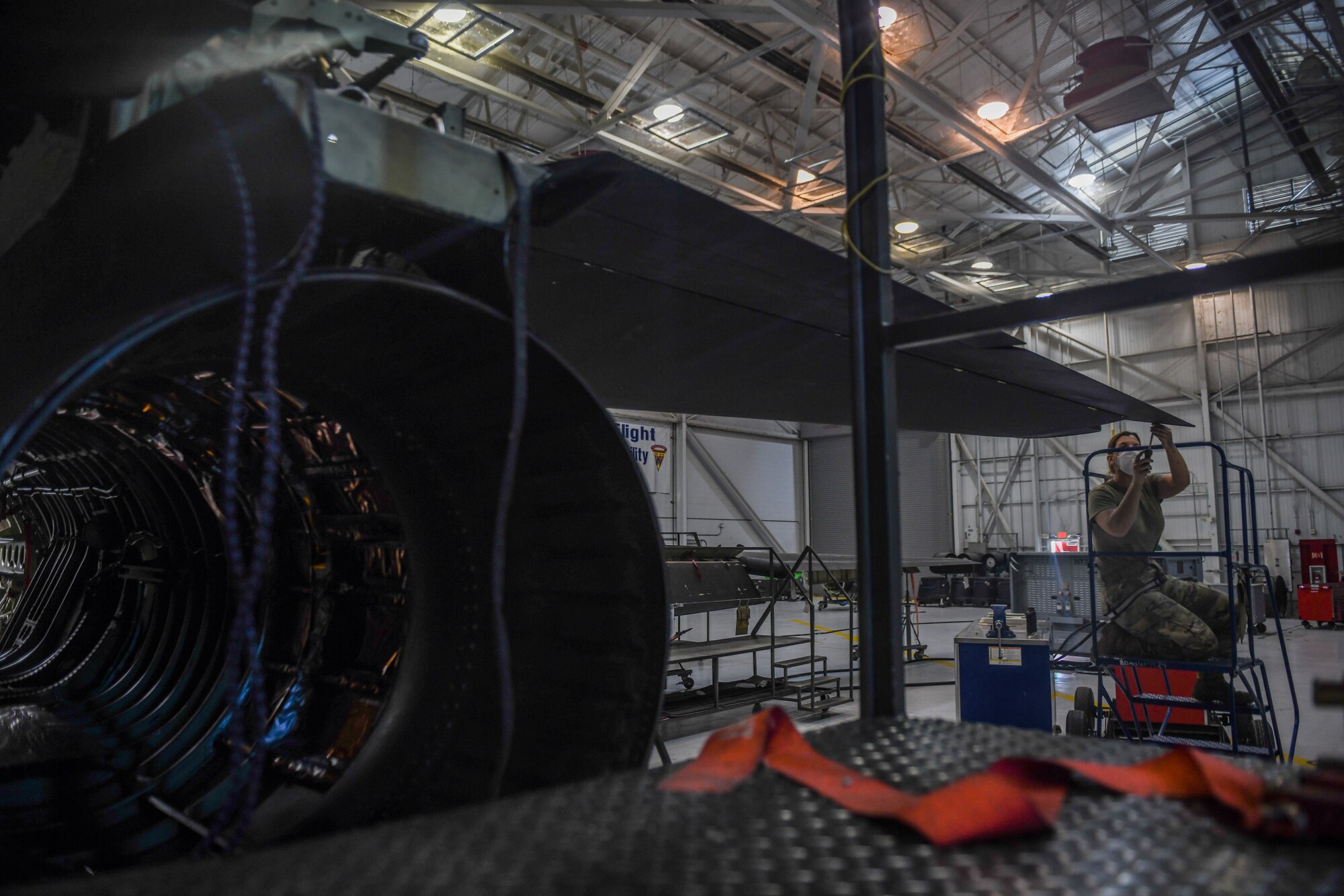 9th Maintenance Squadron repair and reclamation craftsman, work mon the tail of a U-2 Dragon Lady