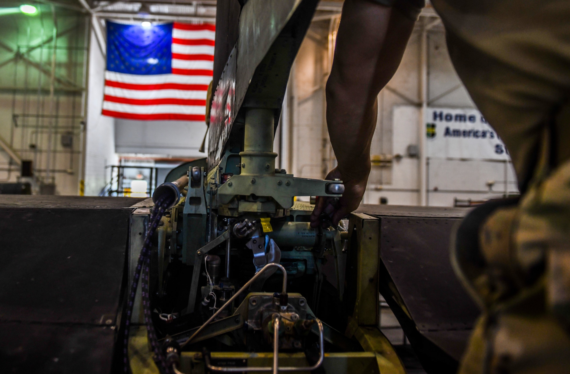 9th Maintenance Squadron repair and reclamation craftsman, work mon the tail of a U-2 Dragon Lady