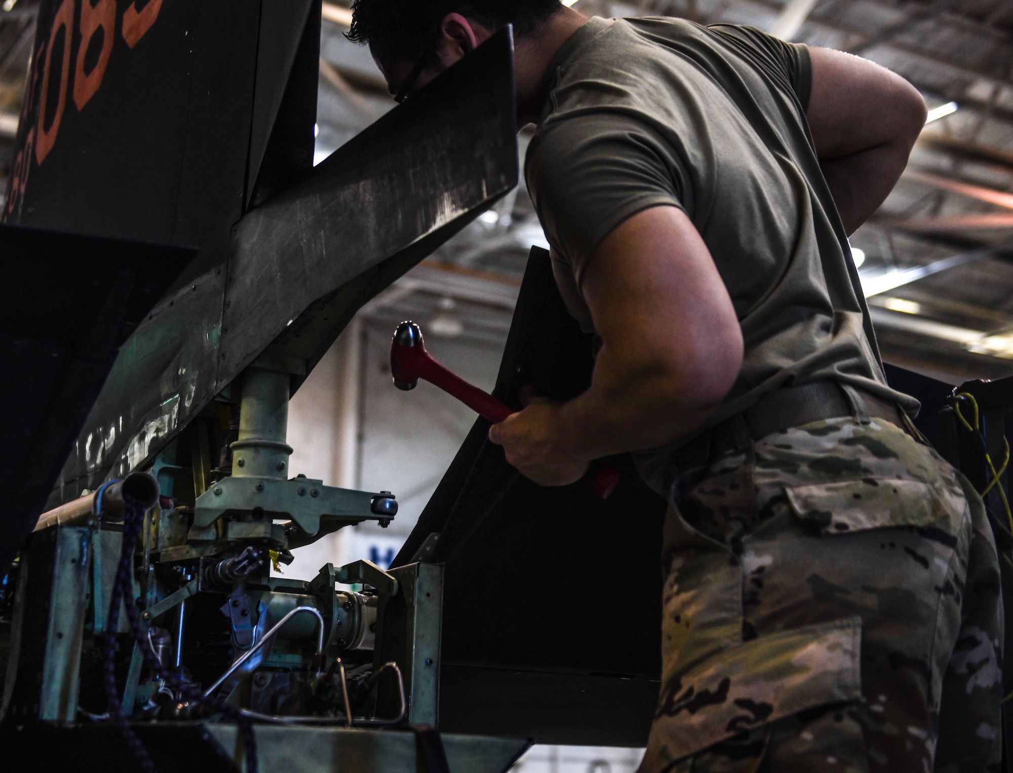 9th Maintenance Squadron repair and reclamation craftsman, work mon the tail of a U-2 Dragon Lady