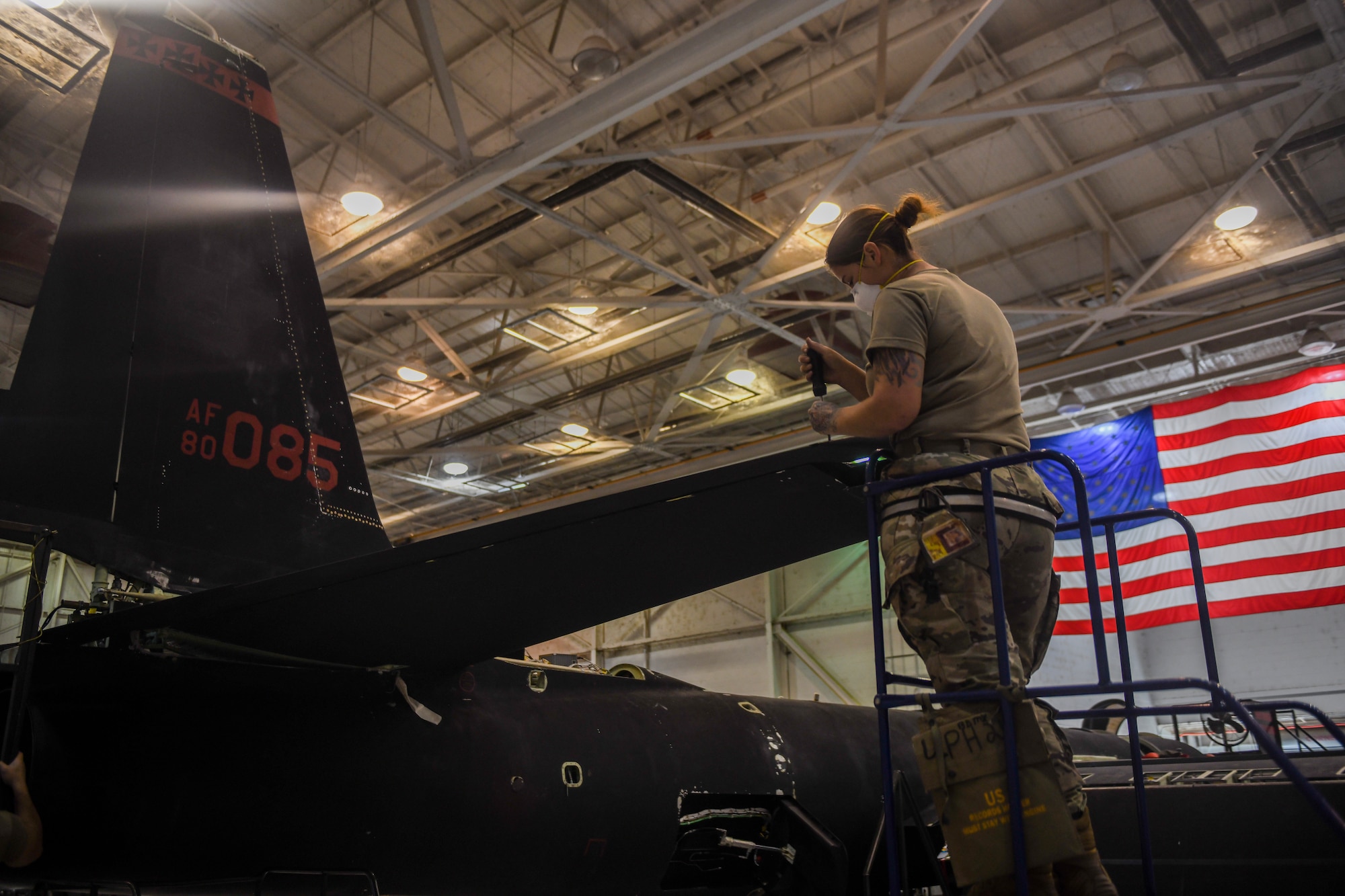 9th Maintenance Squadron repair and reclamation craftsman, work mon the tail of a U-2 Dragon Lady