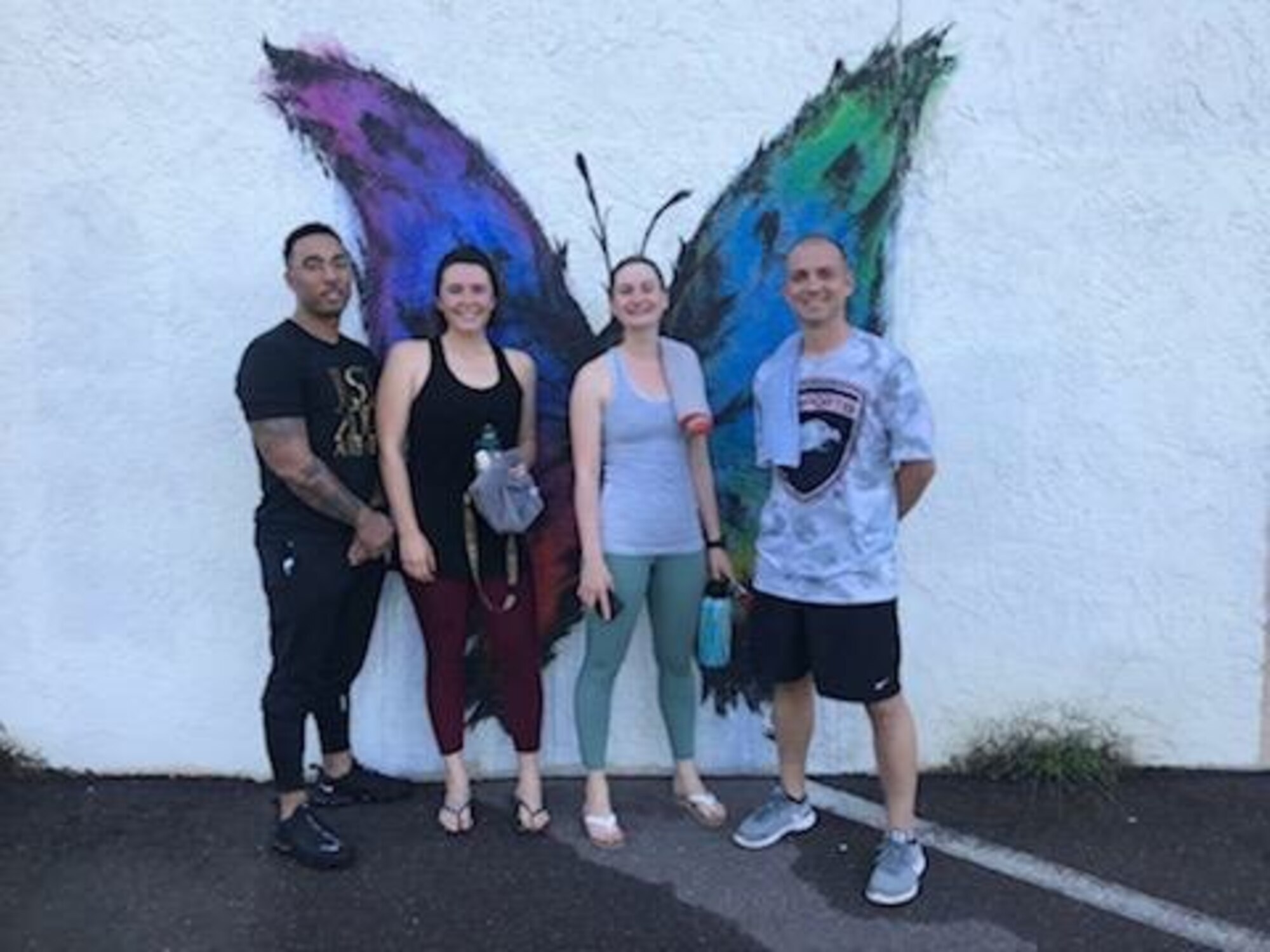 U.S. Air Force Staff Sgt. Sanchez Banks, Staff Sgt. Marissa Nelson, Tech. Sgt. Shawna Wise, and Master Sgt. Matthew Orlando, the 6th Force Support Squadron Airman Leadership School instructor team, pause for a photo after a workout Sept. 2019 in Tampa, Fla