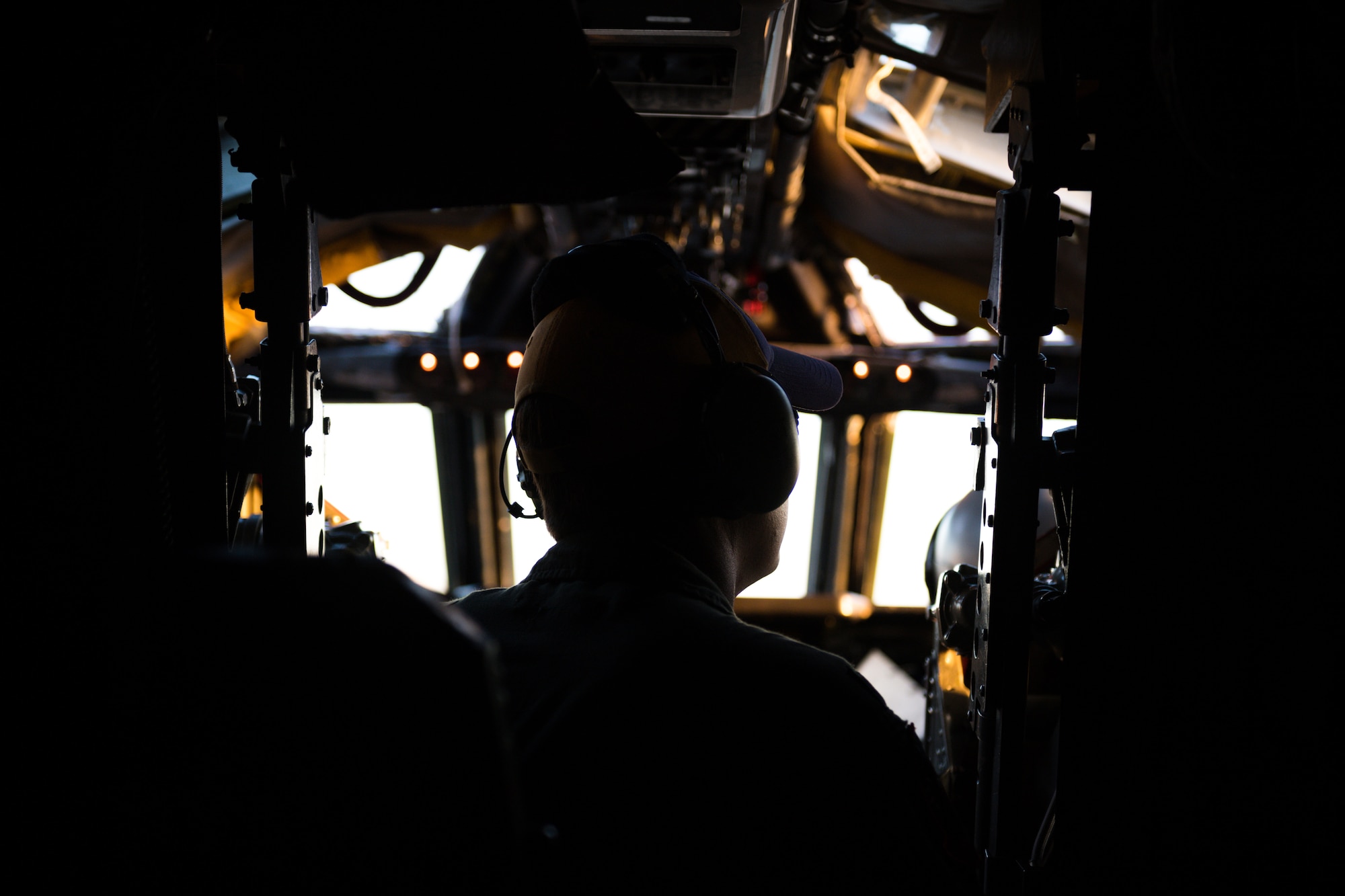 Silhouette of Airman in cockpit of B-52