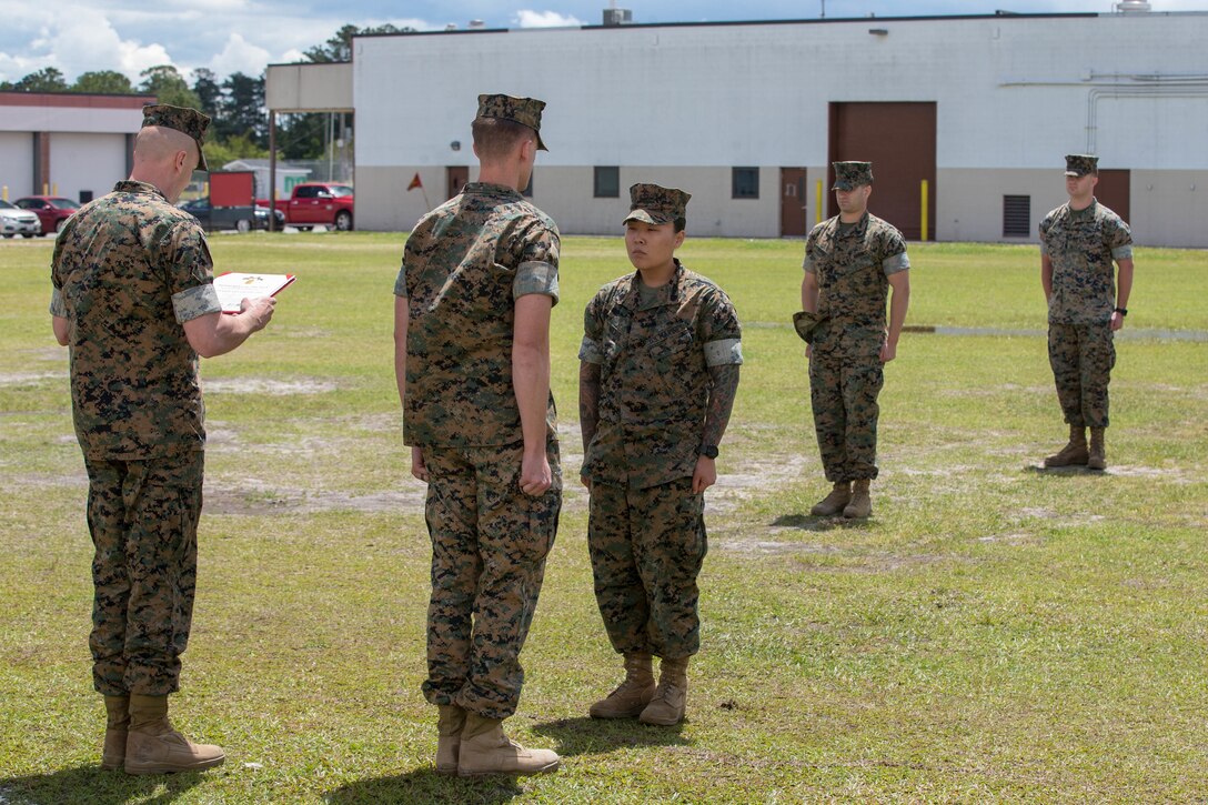 U.S. Marine Corps Sgt. Jennifer Wilbur, receives a Navy and Marine Corps Achievement Medal at Camp Lejeune, N.C., May 1, 2020. Wilbur, a 25 year-old Clearwater, Florida native and chief instructor for the College of Enlisted Military Education Courses, 2nd Maintenance Battalion, was the winner of the second quarter’s Commanding General Innovation Challenge for her introduction of Design Thinking into command sponsored primary military education courses. Design Thinking encourages organizations to focus on the people they are creating for, which leads to better products, services, and internal processes. (U.S. Marine Corps photo by Lance Cpl. Scott Jenkins)