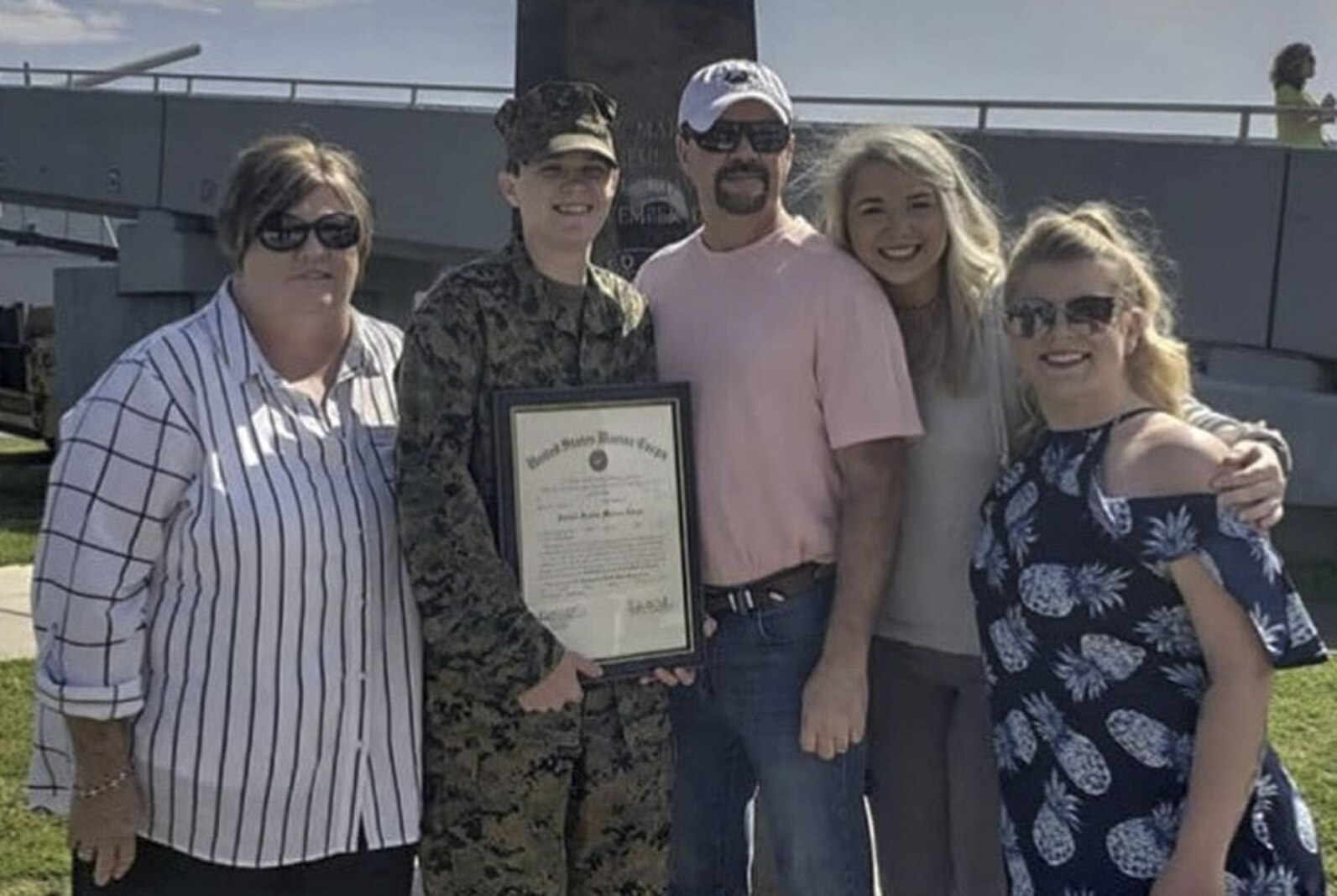 Staff Sgt. Kirk poses for a photo with her family after her promotion to Staff Sgt. aboard the USS Alabama in Mobile, AL. The USS Alabama saw service across the globe during World War II and has been preserved as a museum ship in Mobile Bay, AL since 1964.