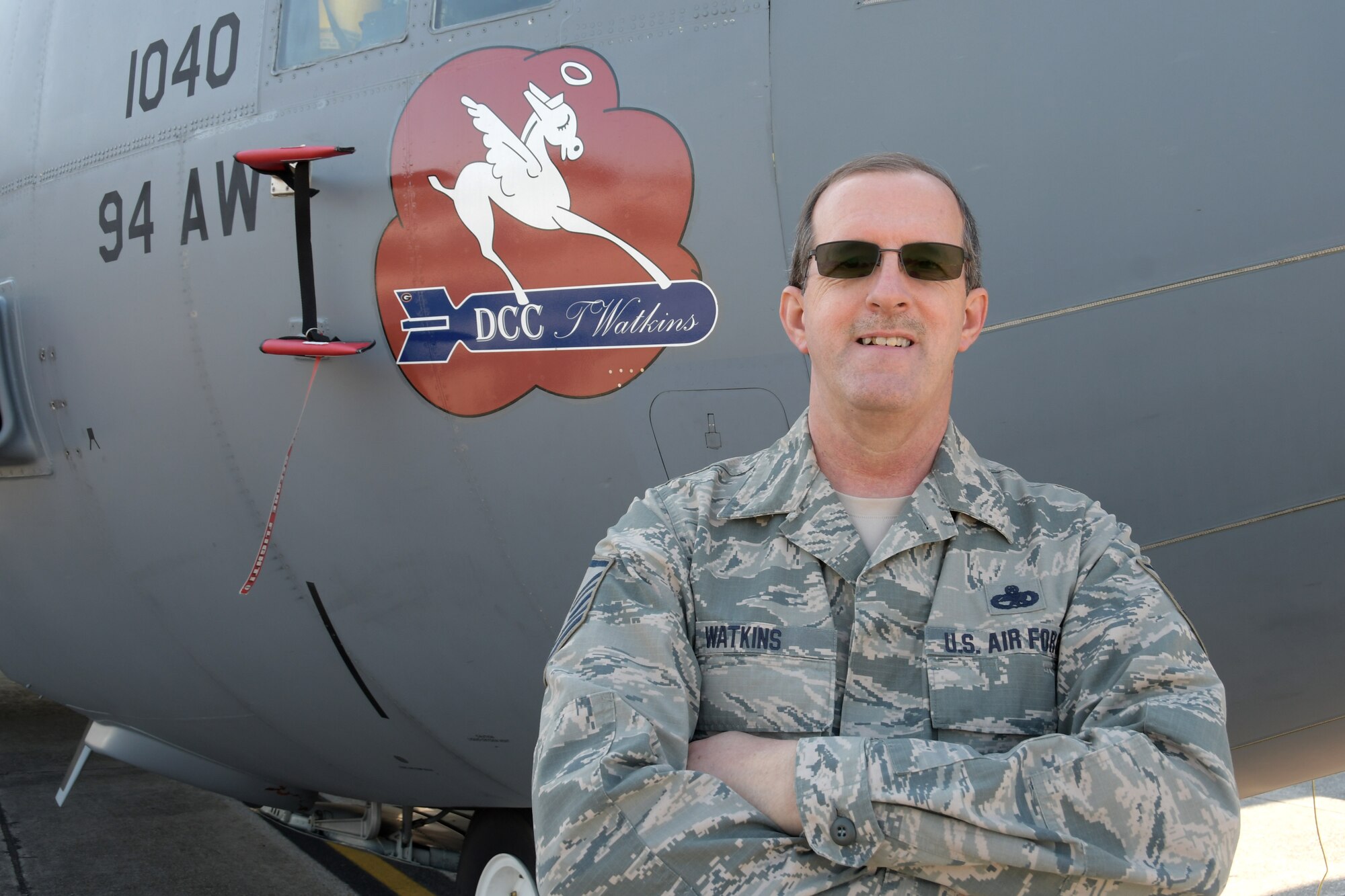 Master Sgt. Tim Watkins, 94th Aircraft Maintenance Squadron dedicated crew chief, poses for a photo in front of the C-130H3 Hercules he maintains at Dobbins Air Reserve Base, Ga. on May 4, 2020. Watkins retired this week after 34 years of service - 29 of which were at Dobbins. (U.S. Air Force photo/Andrew Park)