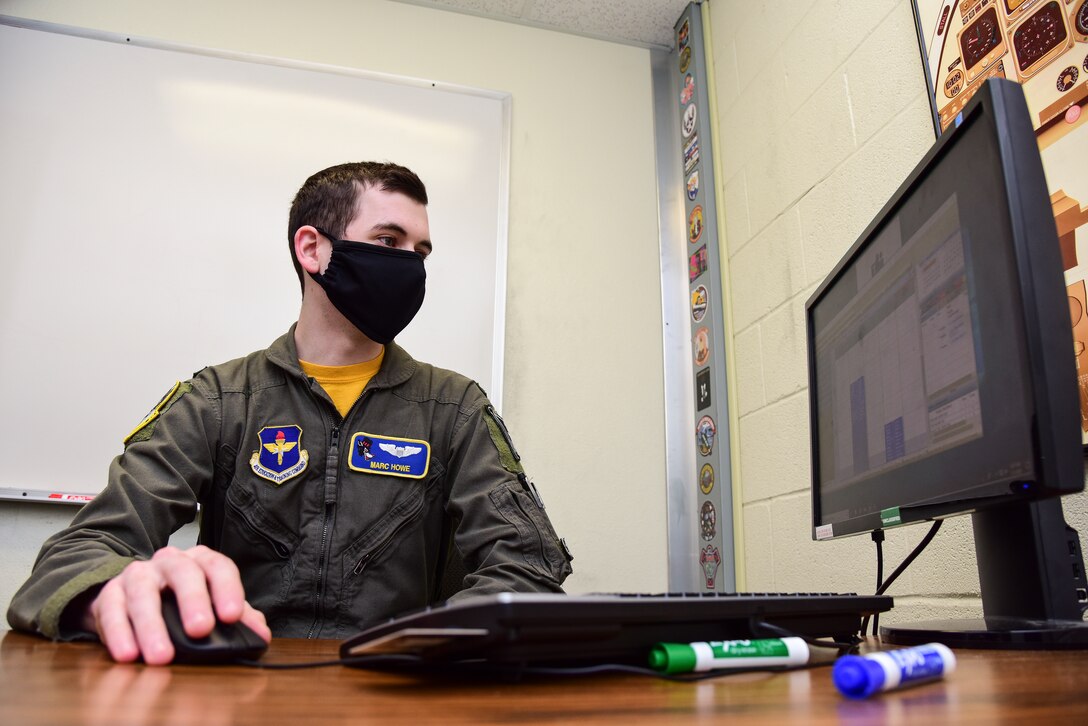 First Lt. Marc Howe, 86th Flying Training Squadron flight scheduler and instructor pilot, takes on the task of preparing a quality schedule for his team, May 1, 2020 at Laughlin Air Force Base, Texas. Howe is a first assignment instructor pilot, and he believes doing his job--whether it's creating schedules or instructing students--to the best of his ability is what he owes his team to keep morale high and the mission progressing. (U.S. Air Force photo by Senior Airman Anne McCready)