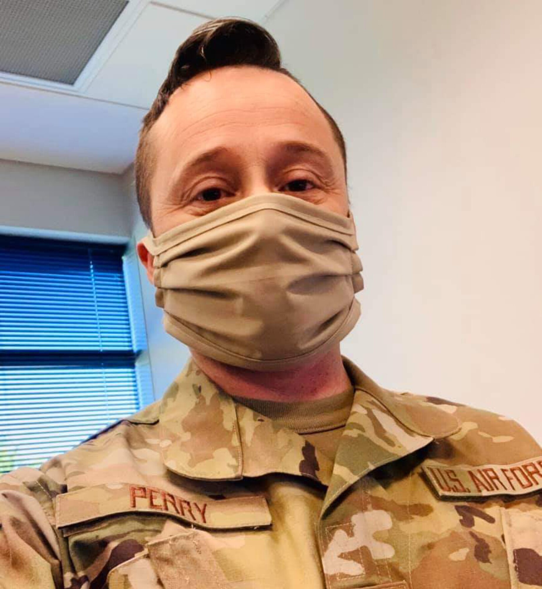 Tech. Sgt. Donnie Perry, 332d Recruiting Squadron Military Enlisted Processing Station liaison, wears a cloth protective masks while performing his duties in Nashville, Tenn., May 4, 2020.
