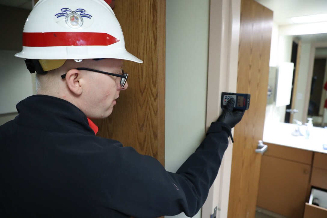 Andy Temeyer, architect, U.S. Army Corps of Engineers – Omaha District, uses a laser ranger finder to measure the width of a bathroom doorway during a site assessment April 6, of a building in Omaha, Neb., the state is considering turning into an alternate care facility in the battle against the COVID-19 pandemic. When requested by states and/or territories and funded by FEMA, USACE is conducting site assessments for potential alternate care facilities. A site assessment does not guarantee construction at that site.
