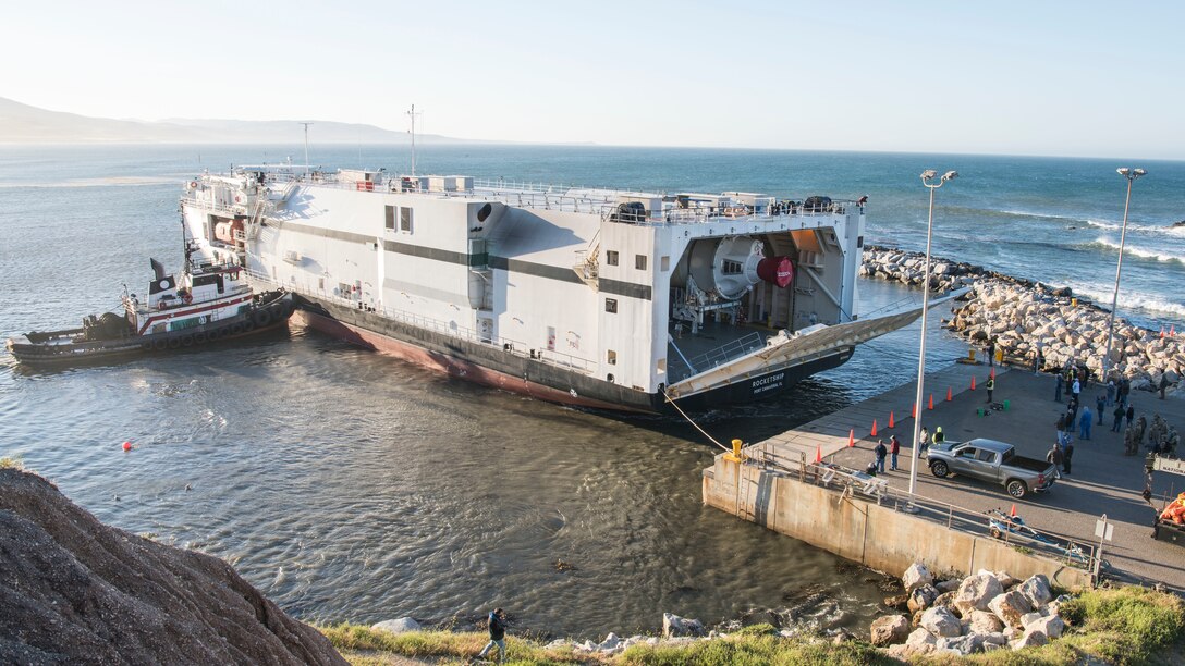 The hatch opens on a United Launch Alliance barge, known as the RocketShip, revealing a Delta IV Heavy booster May 4, 2020, at Vandenberg Air Force Base, Calif. The barge docked at Vandenberg AFB to offload the final Delta IV Heavy booster for an upcoming launch scheduled to occur later this year. The barge operation is a vital first step to executing the mission of assured access to space. (U.S. Air Force photo by Senior Airman Aubree Owens)