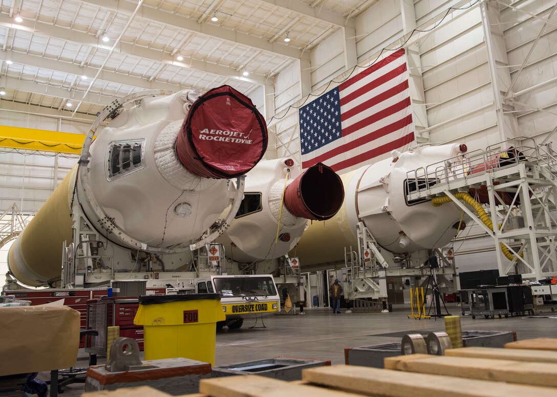 Three Delta IV Heavy boosters, which were extracted from a United Launch Alliance barge known as the RocketShip, are placed in a Horizontal Integration Facility, May 4, 2020, at Vandenberg Air Force Base, Calif. A HIF is a building within which the stages of a multistage rocket are brought together before the assembled stack is rolled out to the launch pad or space launch complex and raised into a vertical position for final integration and launch. (U.S. Air Force photo by Senior Airman Aubree Owens)