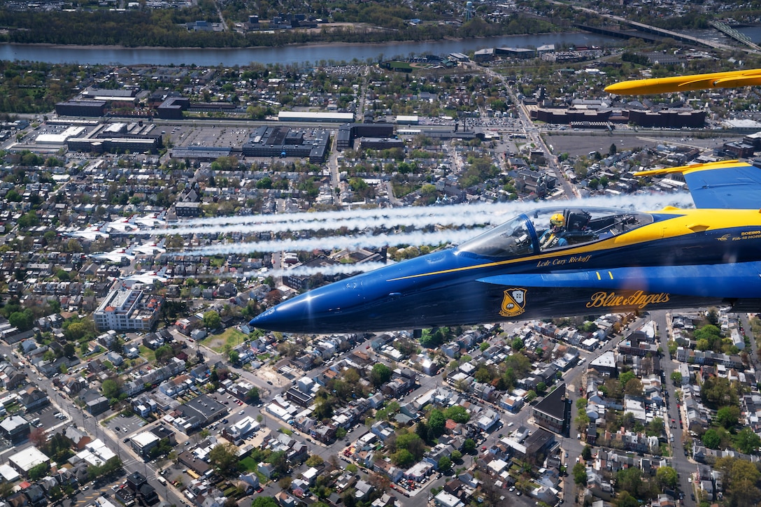 Airborne view of military aircraft flying in formation.