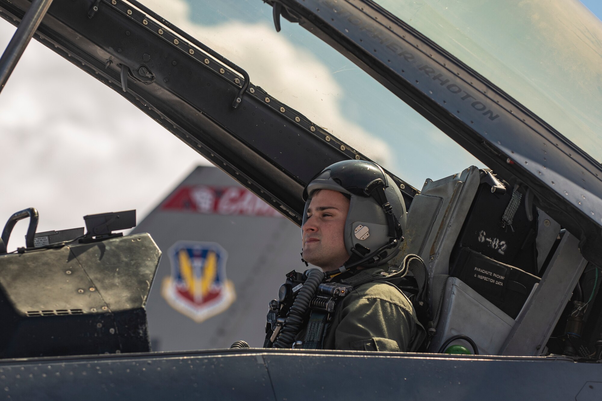 An Airman sits in the cockpit of a F-16.