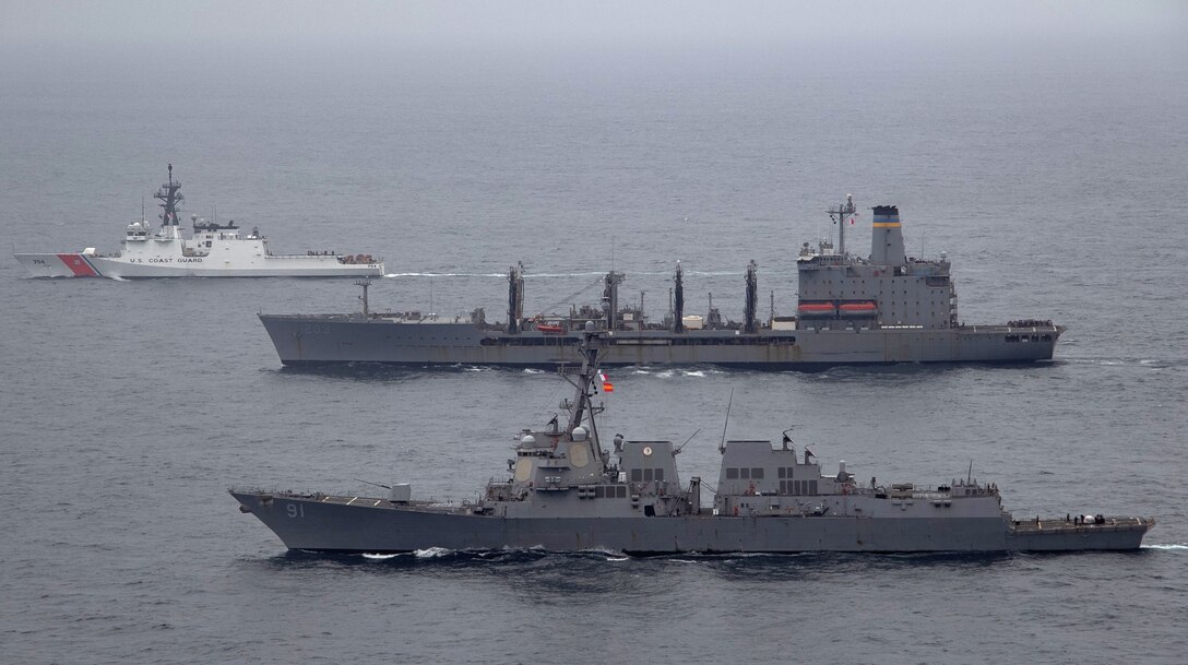 USS Pinckney USNS Laramie and U.S. Coast Guard Cutter James transit the Pacific Ocean together.