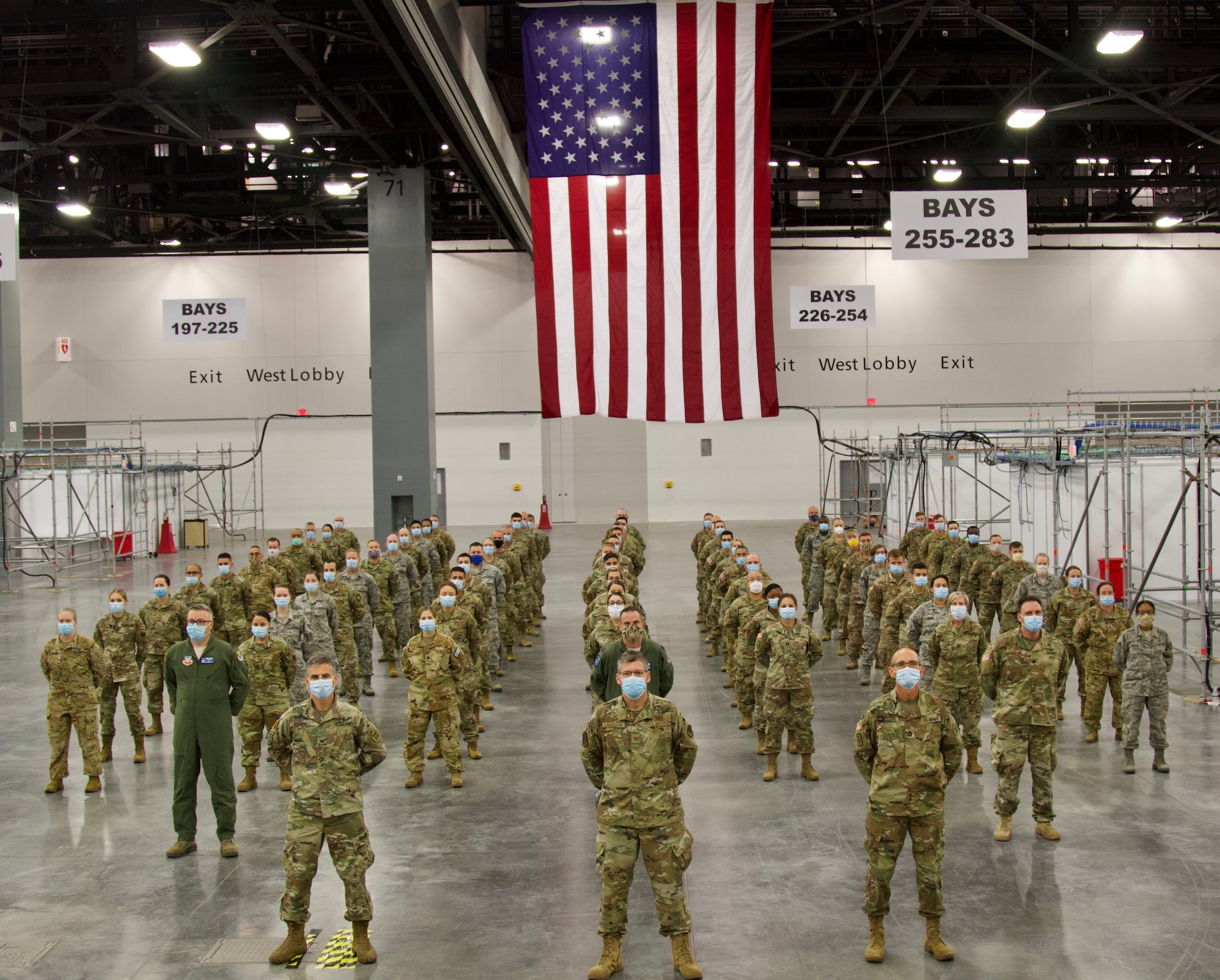 Joint Task Force Aid staff members pose for a group photo at alternate care facility Miami Beach Convention Center. The FLNG has responded to the COVID-19 effort and continues to support the mission. (US Army photo by Sgt. Leia Tascarini)