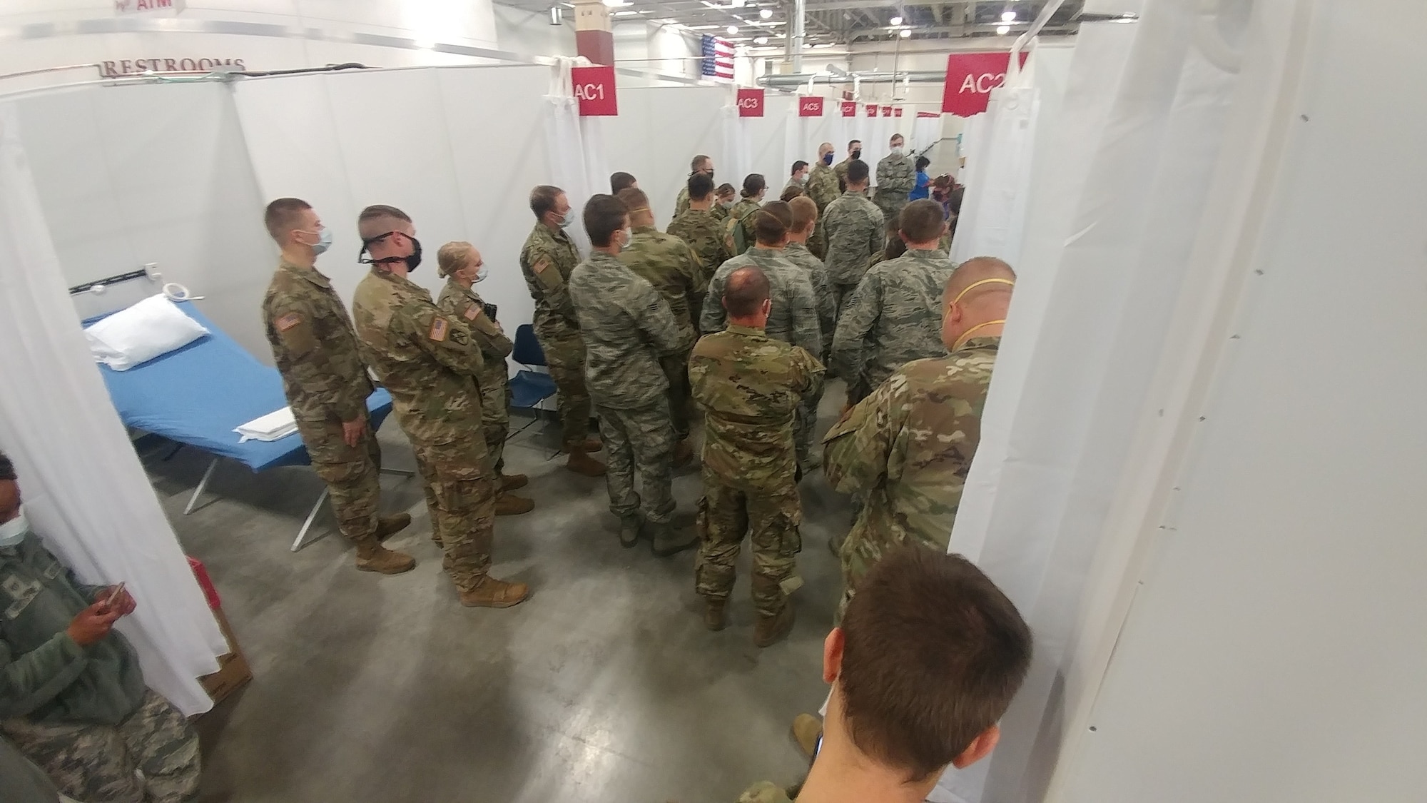 Wisconsin National Guard members from the 128th Air Refueling Wing, the 115th Fighter Wing, and the 1157th Transportation Company tour the alternate care facility built in the Wisconsin State Fair Park Exposition Center in , West Allis, Wis., April 22, 2020. The Wisconsin National Guard always stands ready to assist civil authorities in times of need.
(U.S. Air National Guard photo by Senior Airman Valerie Lopez).