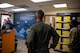 Col. Stephen R. Jones, 432nd Wing/432 Air Expeditionary Wing commander, and Chief Master Sgt. Michelle T. Browning, 432nd WG/432nd AEW command chief, receive a walk-through of the new military clothing sales store from Matthew A. Beatty, Nellis/Creech Air Force Base Exchange general manager, at Creech Air Force Base, Nevada, May 4, 2020.