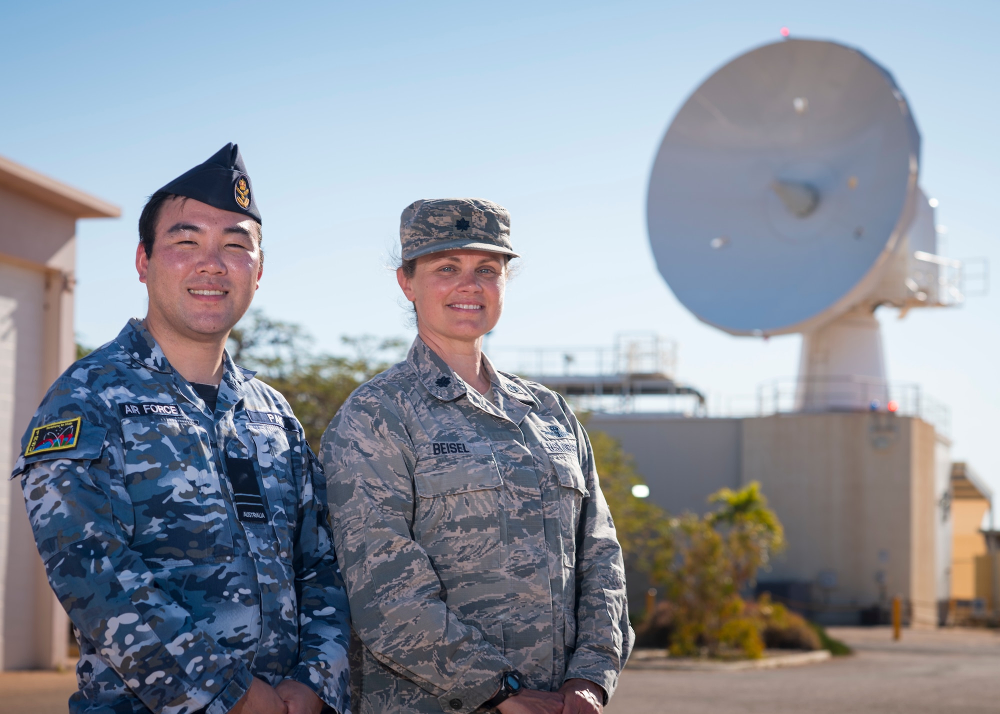 Royal Australian Air Force Flight Lt. James Pak, RAAF No. 1 Remote Sensor Unit, and U.S. Air Force Lt. Col. Jennifer Beisel, space liaison officer , 21st Operations Group, 21st Space Wing, work together to monitor and operate a U.S.-owned C-Band space surveillance radar system at NCS Harold E. Holt, near Exmouth, Australia. Strategically located to cover both the southern and eastern hemisphere, the C-Band radar provides tracking and identification of space assets and debris for the U.S. space surveillance network.  (U.S. Navy photo by Mass Communication Specialist 2nd Class Jeanette Mullinax)