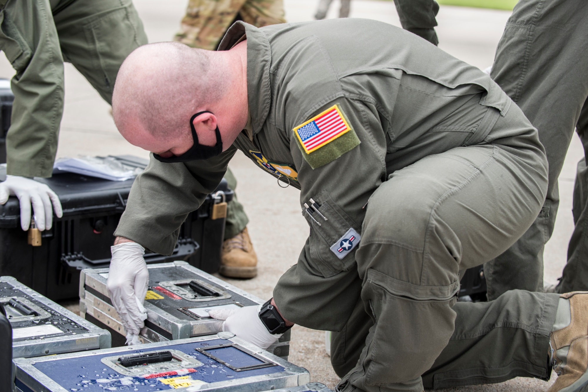 service member sanitizes cargo.