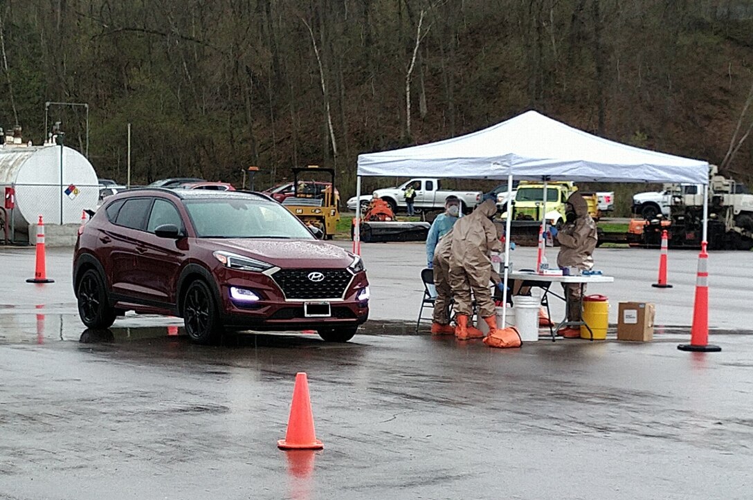 Wisconsin National Guard members prepare to collect a specimen from a member of the community in Alma May 1, 2020. Nearly a dozen Wisconsin National Guard teams are supporting specimen collection missions at mobile COVID-19 testing sites around Wisconsin.