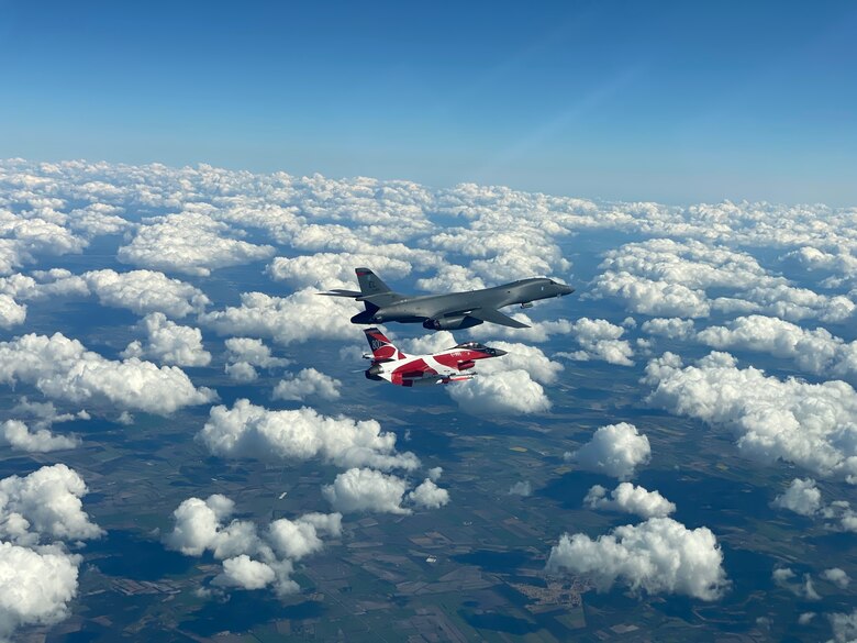 A B-1B Lancer flies with a Danish F-16 during a training mission for Bomber Task Force Europe, May 5, 2020. Aircrews from the 28th Bomb Wing at Ellsworth Air Force Base, South Dakota, took off on their long-range, long-duration Bomber Task Force mission to conduct interoperability training with Danish fighter aircraft and Estonian joint terminal attack controllers ground teams. Training with our NATO allies and theater partner nations contribute to enhanced resiliency and interoperability and enables us to build enduring relationships necessary to confront the broad range of global challenges. (Courtesy photo by Danish Air Force)