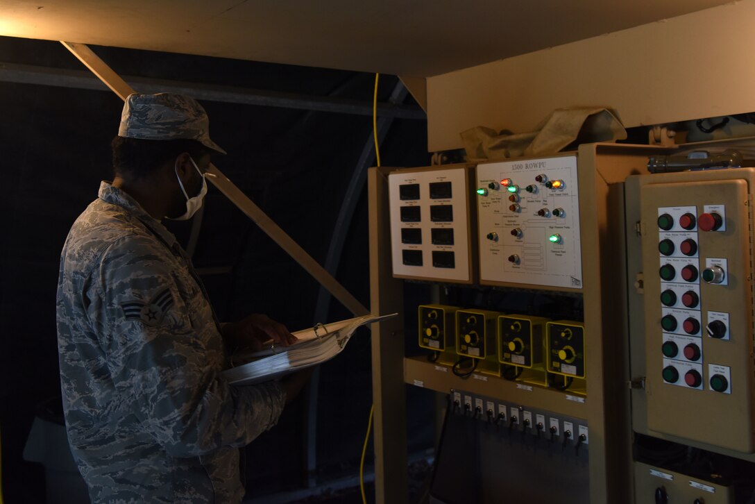 U.S. Air Force Senior Airman Brandon Williams, 786th Civil Engineer Squadron water and fuel systems maintenance journeyman, performs a proficiency test on the reverse osmosis water purification unit.