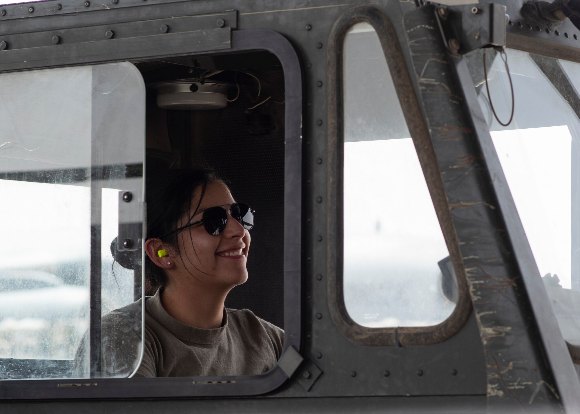 Airman prepares to load cargo onto aircraft.