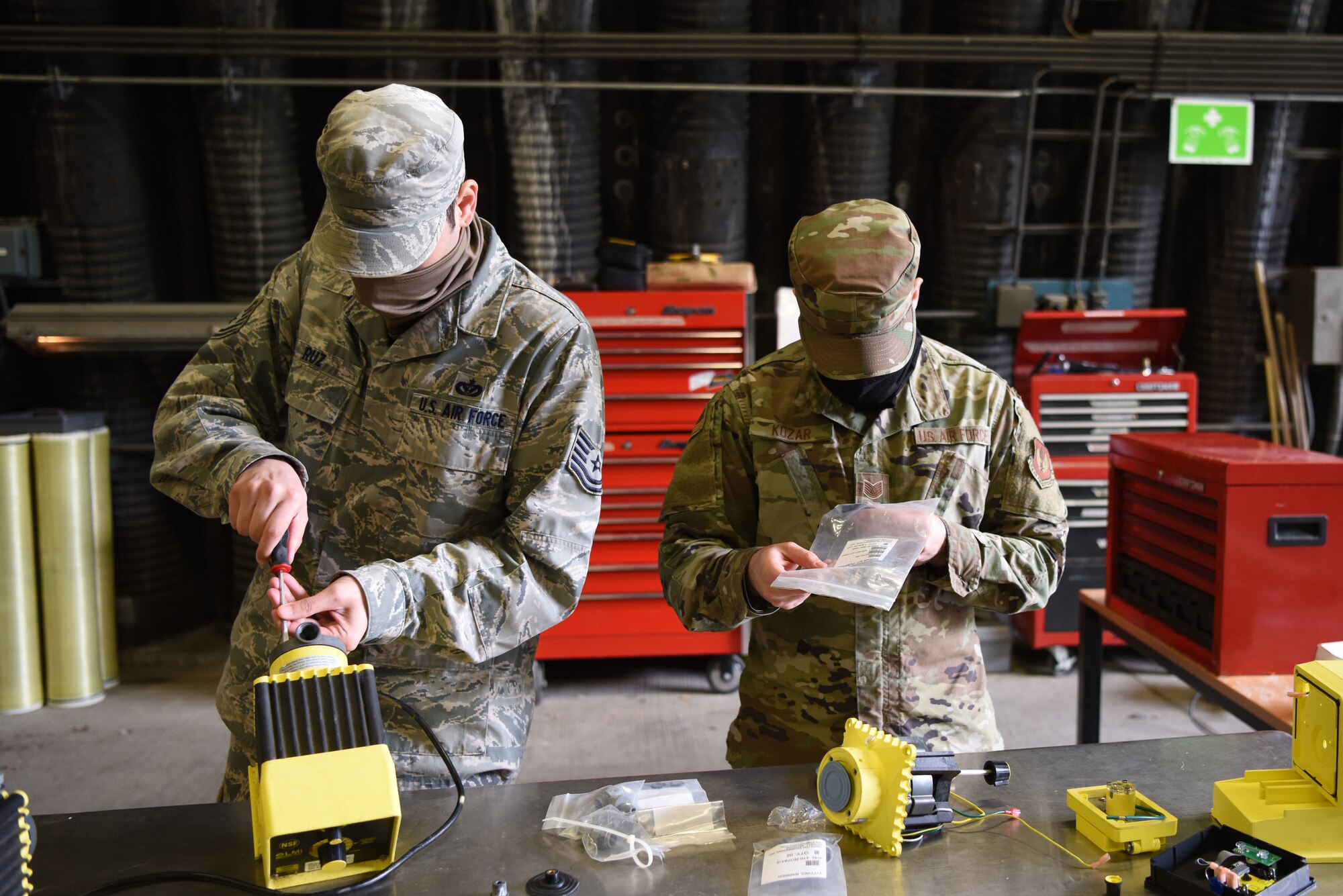 U.S. Air Force Tech Sgt. Isaac Ruz, 786th Civil Engineer Squadron water and fuel systems maintenance supervisor, left, and Tech Sgt. Nikki Kozar, 786th CES water plant noncommissioned officer in charge, conducts maintenance on water purification systems during proficiency training.