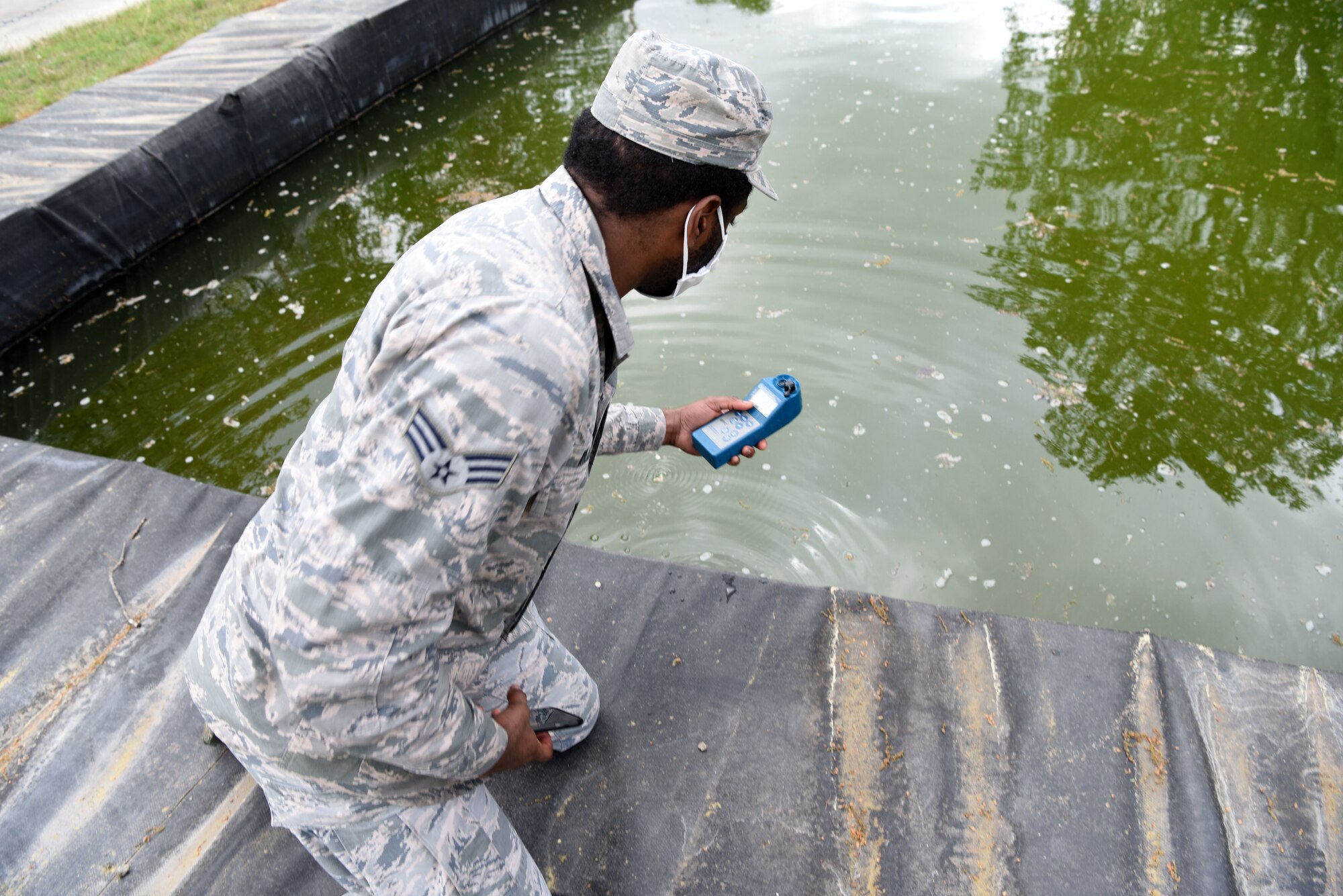 U.S. Air Force Senior Airman Brandon Williams, 786th Civil Engineer Squadron water and fuel systems maintenance journeyman, conducts a water purification test during proficiency training.
